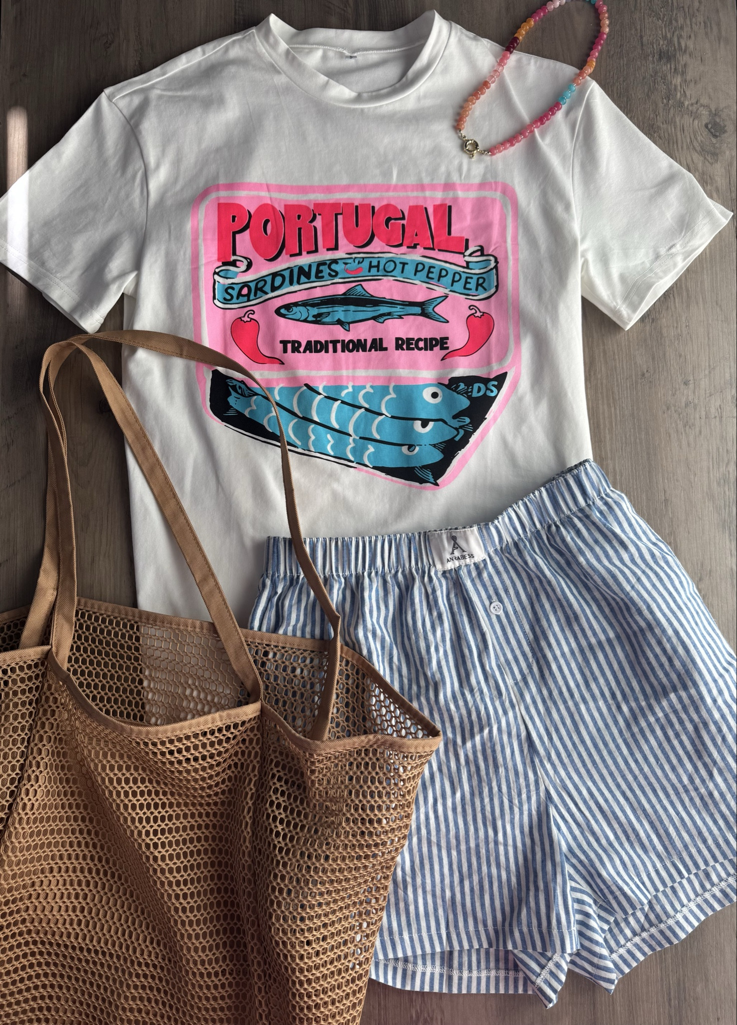Summer sardine graphic tee, striped boxer shorts, and mesh tote bag. Grab your normal size in everything





vacation outfits, tropical outfits, beach outfits, beach clothes, resort wear 2026, summer outfits, beach vacation outfit, sardine tee, coastal outfit, coastal graphic tee, striped shorts, summer shorts 

#LTKPetite #LTKSaleAlert #LTKootd