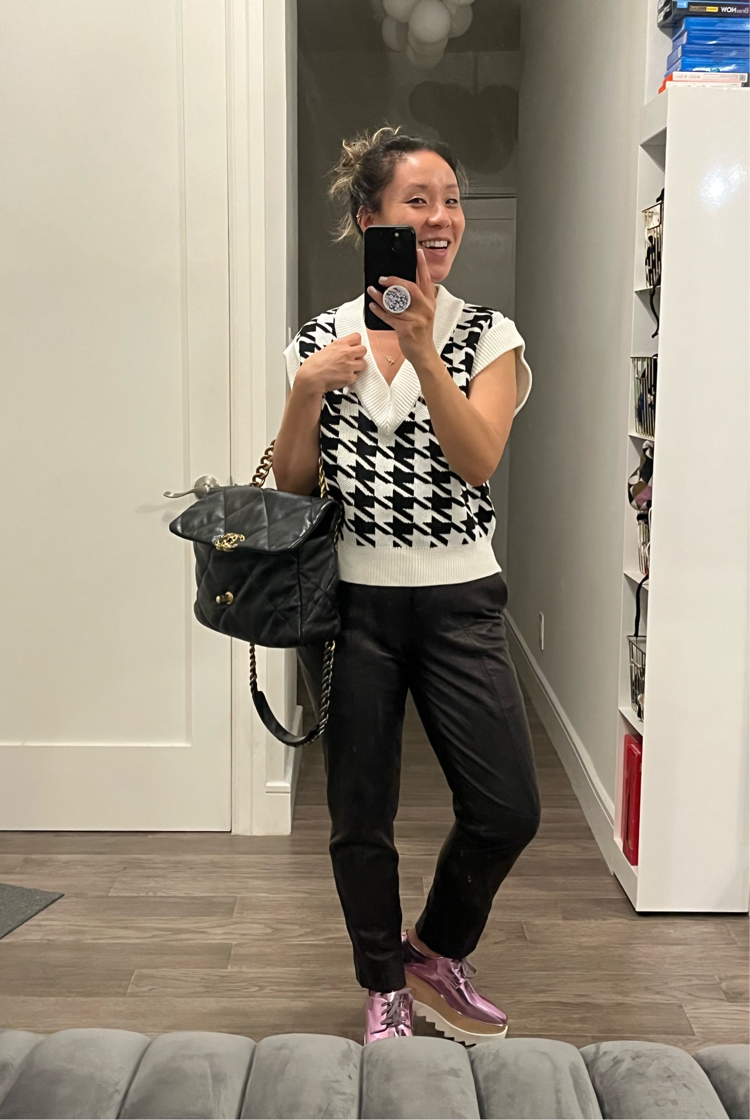 Am I obsessed with oversized sweater vests? Black and white houndstooth. Leather pants. Fall outfit.

#LTKunder100 #LTKtravel #LTKshoecrush