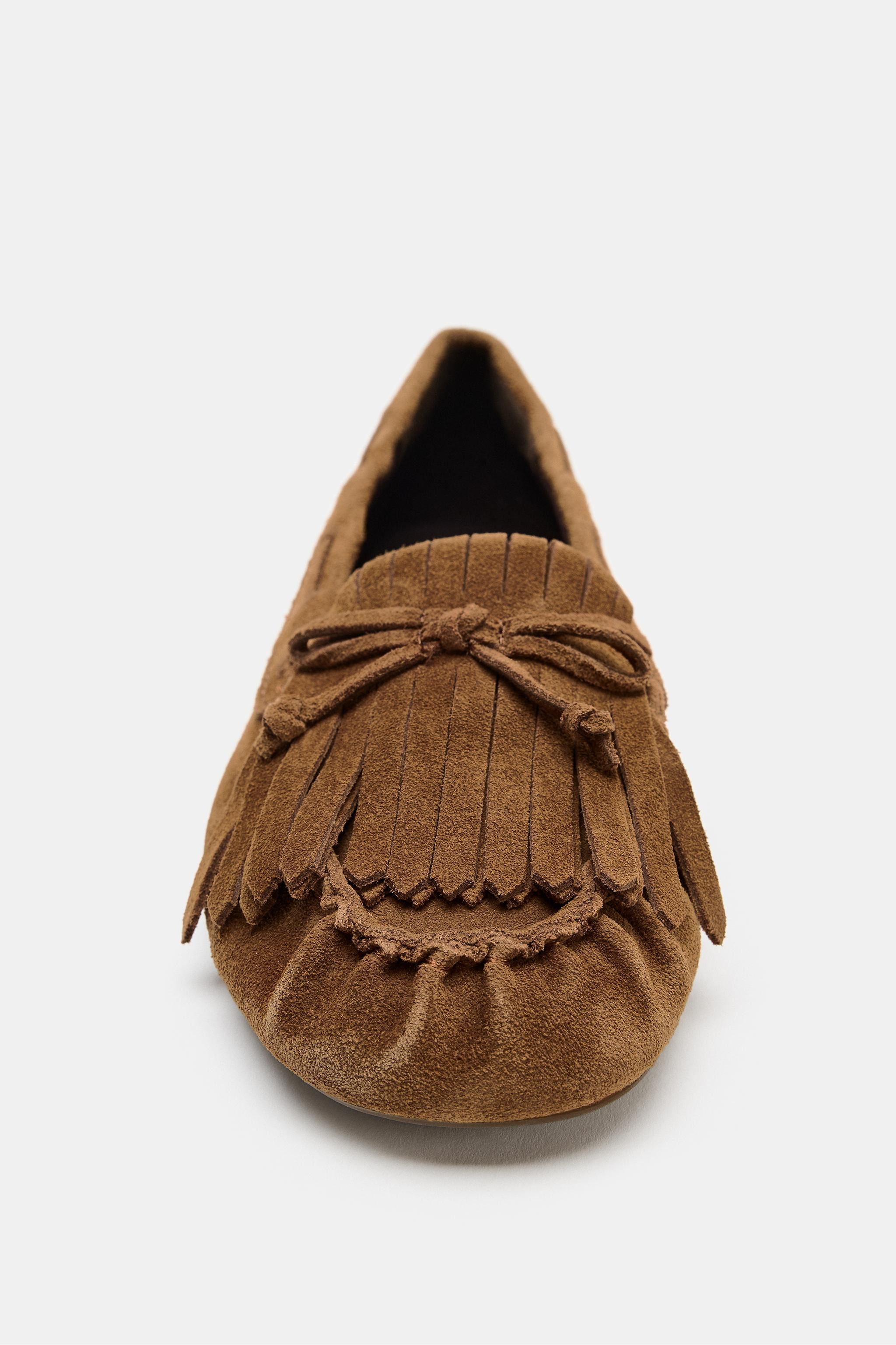 Split suede loafers. Side lacing detail and fringe at the front. Flat rubberized sole. Rounded to... | Zara US