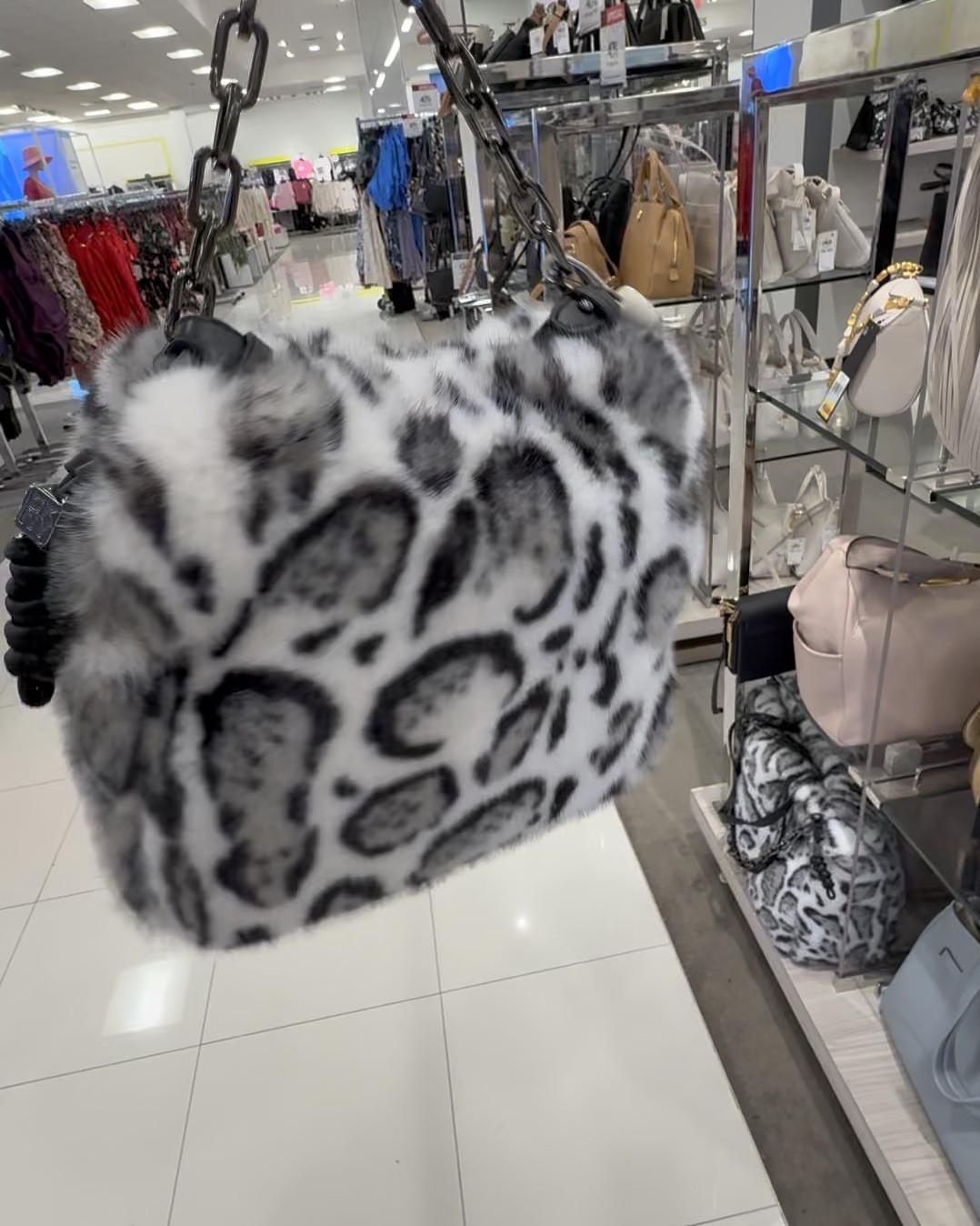 I love both of these sizes - one as a handbag and one as a large tote -  and I love anything snow leopard. Both of these are on sale. The tote comes with a decorative chain and it has D-rings that could be used for a crossbody strap. Love these bags - very snuggly. 

#LTKSaleAlert #LTKmomlife #LTKTravel