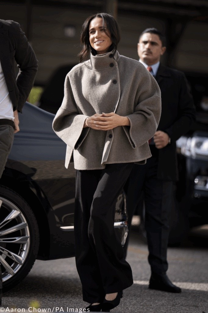 Meghan Markle's $169 Jacket made of wool blend yarn. High neck and long sleeves. Hidden front pockets in the seam. Contrast topstitching detail. Front button closure.
