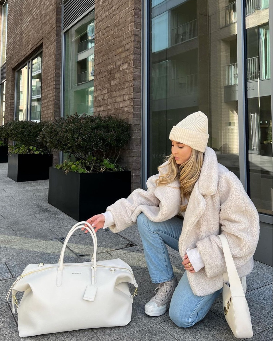 Cream & blue ootd featuring the new Katie Loxton collection. A perfect look for transitioning into spring. Boucle converse, blue straight leg jeans, Karen millen cropped faux shearling jacket, cream knit beanie hat, cream shoulder bag & weekend bag  

#LTKeurope #LTKfamily #LTKstyletip