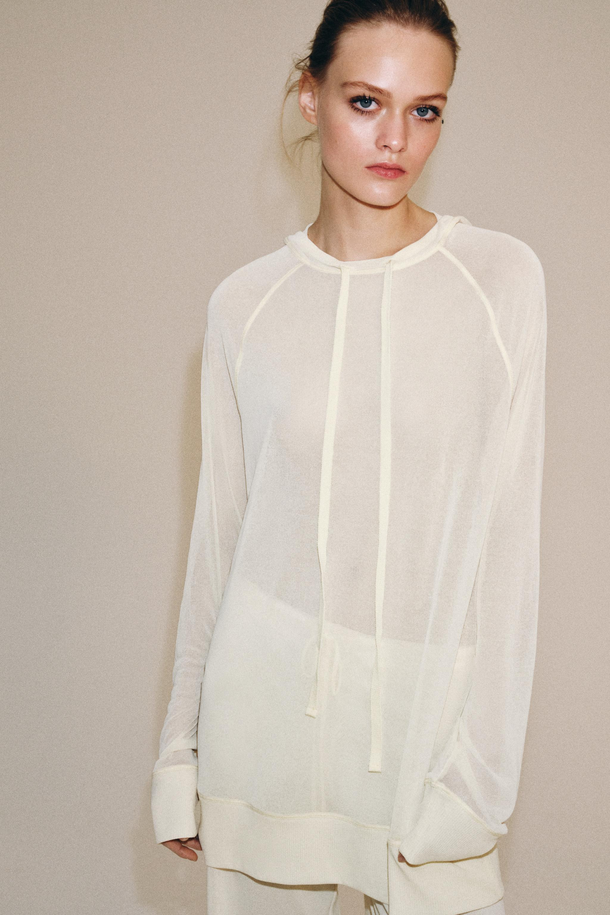 Sweatshirt made of semi-sheer fabric. Round neck with adjustable drawstrings. Long sleeves. | Zara US