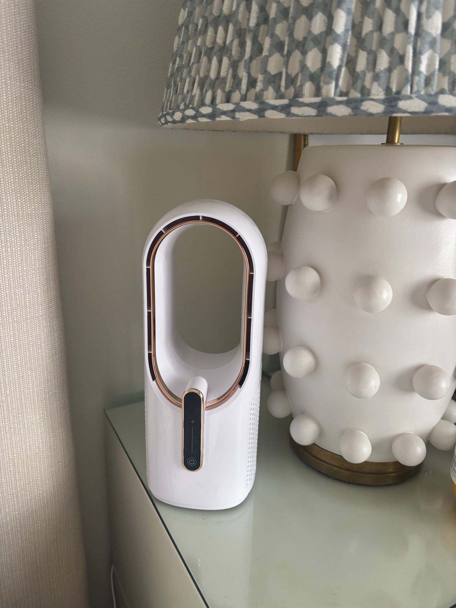 Bladeless bedside fan that has 3 levels of speed. Very quiet- it has been a game changer for me! 

