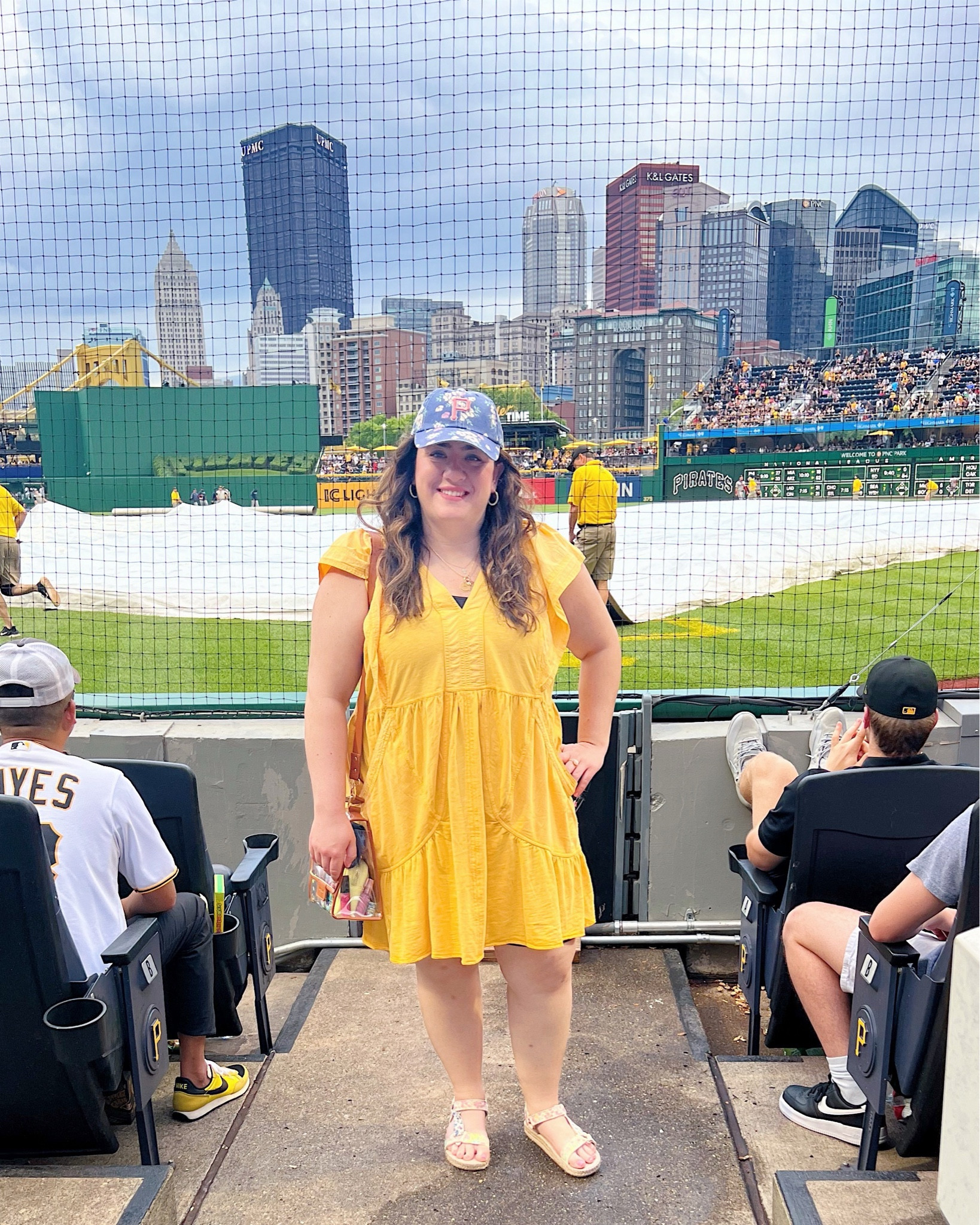 Casual yellow mini dress, floral baseball cap, clear stadium bag 

#LTKSeasonal #LTKMidsize #LTKFindsUnder100