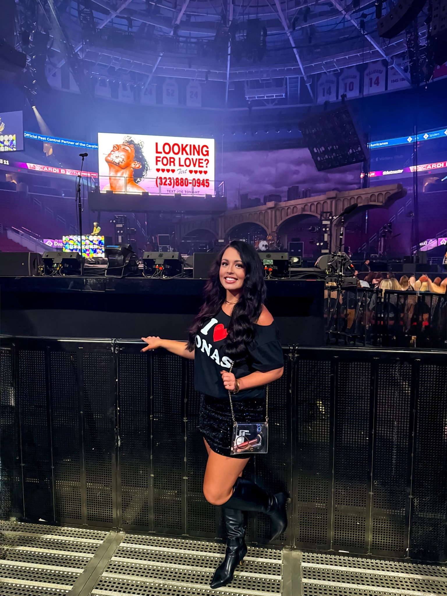 Jonas brothers t shirt, under $22 Amazon black sequin skirt (perfect for the holidays), Amazon clear purse and leather boots. Wearing a medium in the skirt and shirt! #founditonamazon 

#LTKSaleAlert #LTKFindsUnder50 #LTKParties