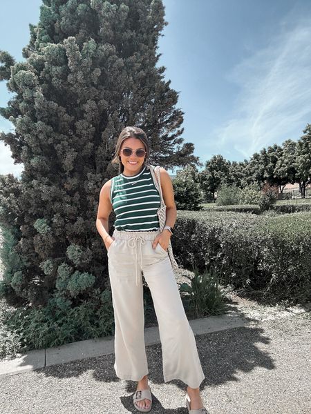 Striped tank top and flowy wide leg pants from LOFT cute outfit for travel or the farmers market

#LTKunder100 #LTKtravel #LTKSeasonal
