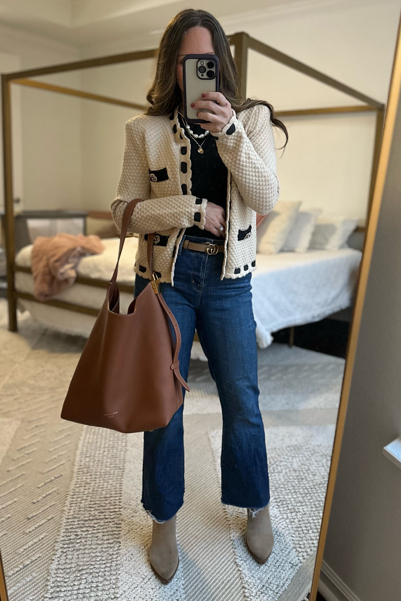 I love the elevated look of this sweater. Ribbon detail, gorgeous flower buttons with small pearls, and (yes!) shoulder pads. It’s the perfect neutral sweater for winter. Paired here with a plain black tee, jeans, and Gucci belt. 

L’AGENCE jeans and sweater (wearing XS in sweater and 27 in jeans), Gucci belt, Louis Vuitton Low Key Hobo bag 

#LTKSeasonal #LTKStyleTip #LTKOver40