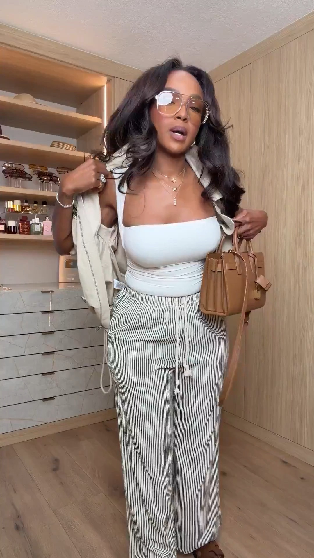 Hi Babes!

This is exactly how I like to do neutrals 🤎✨

The striped wide-leg pants, structured jacket, and rich brown accessories make this outfit look so elevated and expensive. It has that effortless “I just threw this on” vibe while still looking completely put together.

Where to wear this:
• Travel days
• Casual office looks
• Lunch meetings
• Weekend shopping
• Coffee dates
• Sightseeing on vacation

I love mixing soft neutrals and textures because it creates a timeless look you’ll wear year after year.

Everything is linked below!

xx Kira | IG: KirasFashionFinds

34D - 27 - 40 • Size Small or 4 🤎✨✈️

#LTKootd #LTKgrwm #LTKvlog