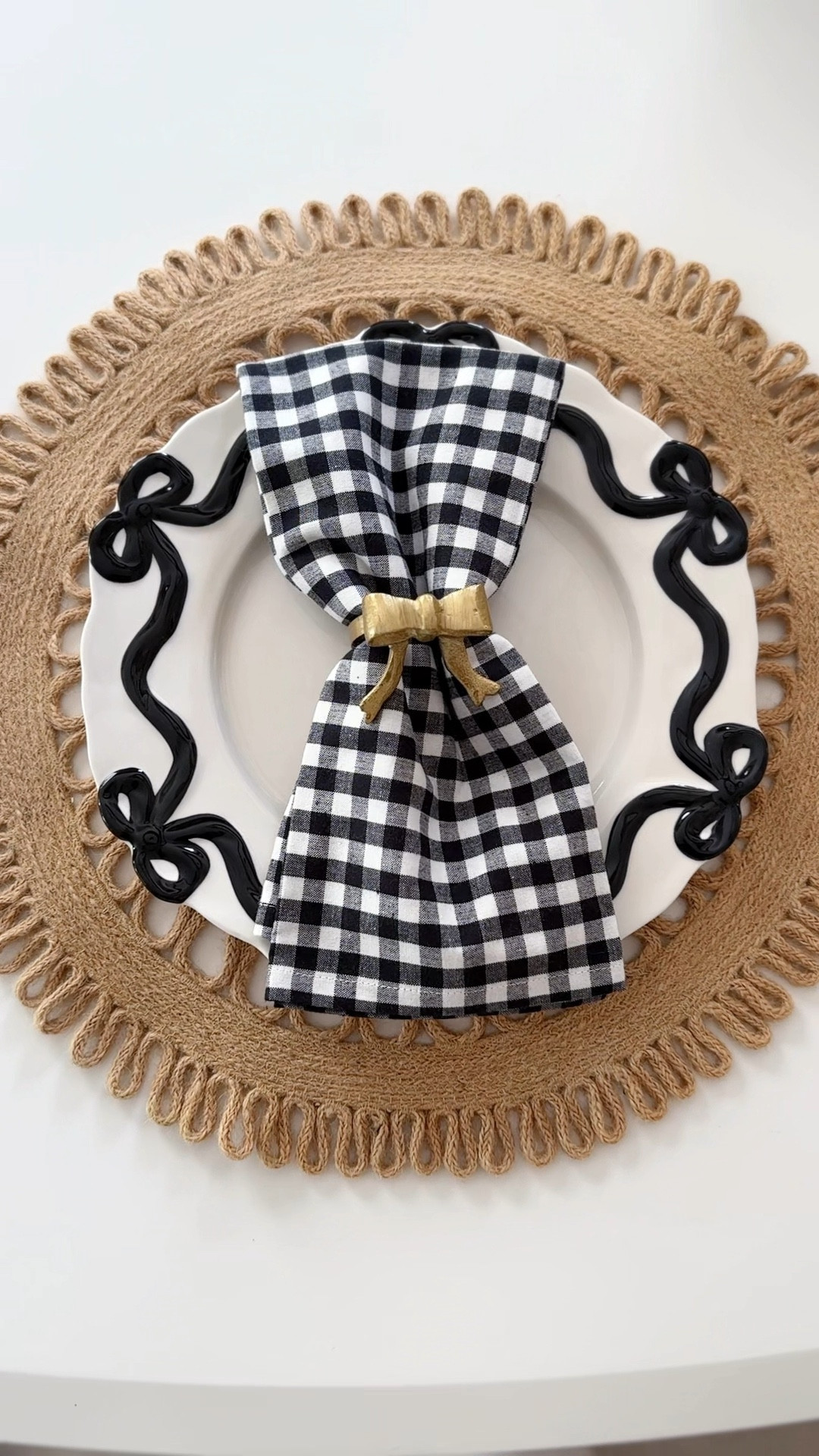 Holiday Bow plate setting
Napkin holder 
Bow plates
Holiday table 

#LTKSeasonal #LTKHoliday #LTKHome