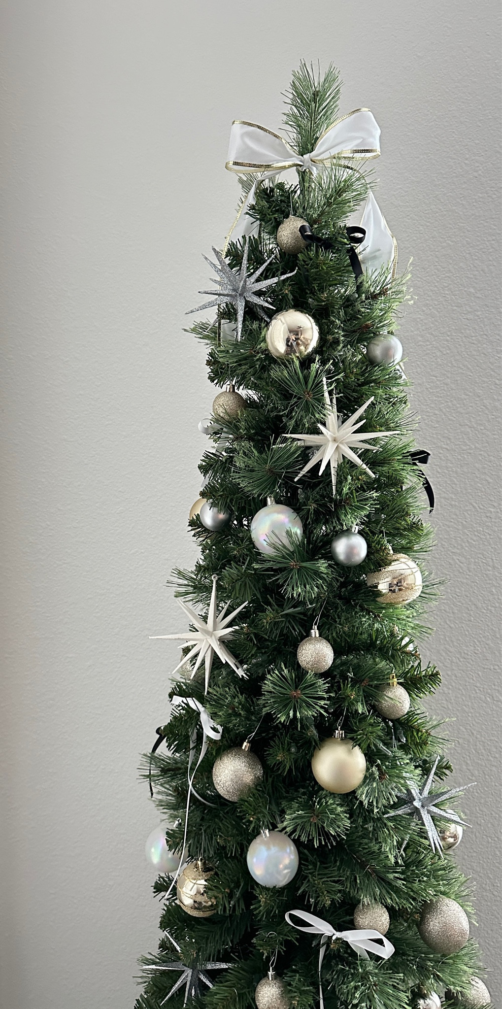 neutral christmas tree | black and white christmas tree | neutral holiday decor | neutral christmas decor | neutral ornaments | pencil tree | 

#LTKSeasonal #LTKfindsunder50 #LTKHoliday