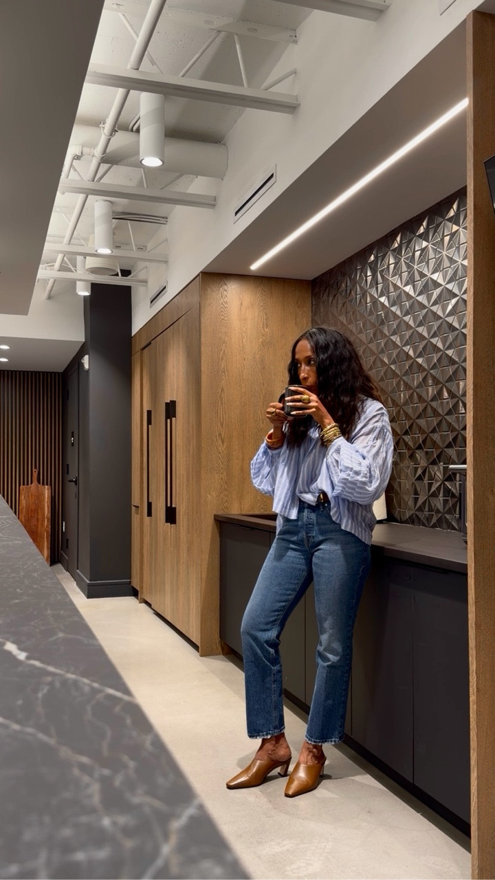 A flowy top to welcome the warmer days ahead, vintage straight ankle jeans, and the perfect mule that will definitely be on repeat this spring.

Working from @vtx_adamsmorgan today and the space is just beautiful.

Outfit linked. Comment SHOP if you want the full look.

This is an effortless spring outfit with a flowy top and vintage straight jeans. This is a casual chic outfit styled with the perfect mule.This is an easy everyday outfit for warmer weather. This is a relaxed coffee moment in a beautiful creative workspace. This is lifestyle fashion content showing effortless everyday style.