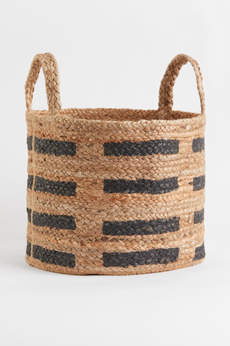 New ArrivalCylindrical storage basket in jute with a printed pattern. Handles at top. Height 11 i... | H&M (US + CA)