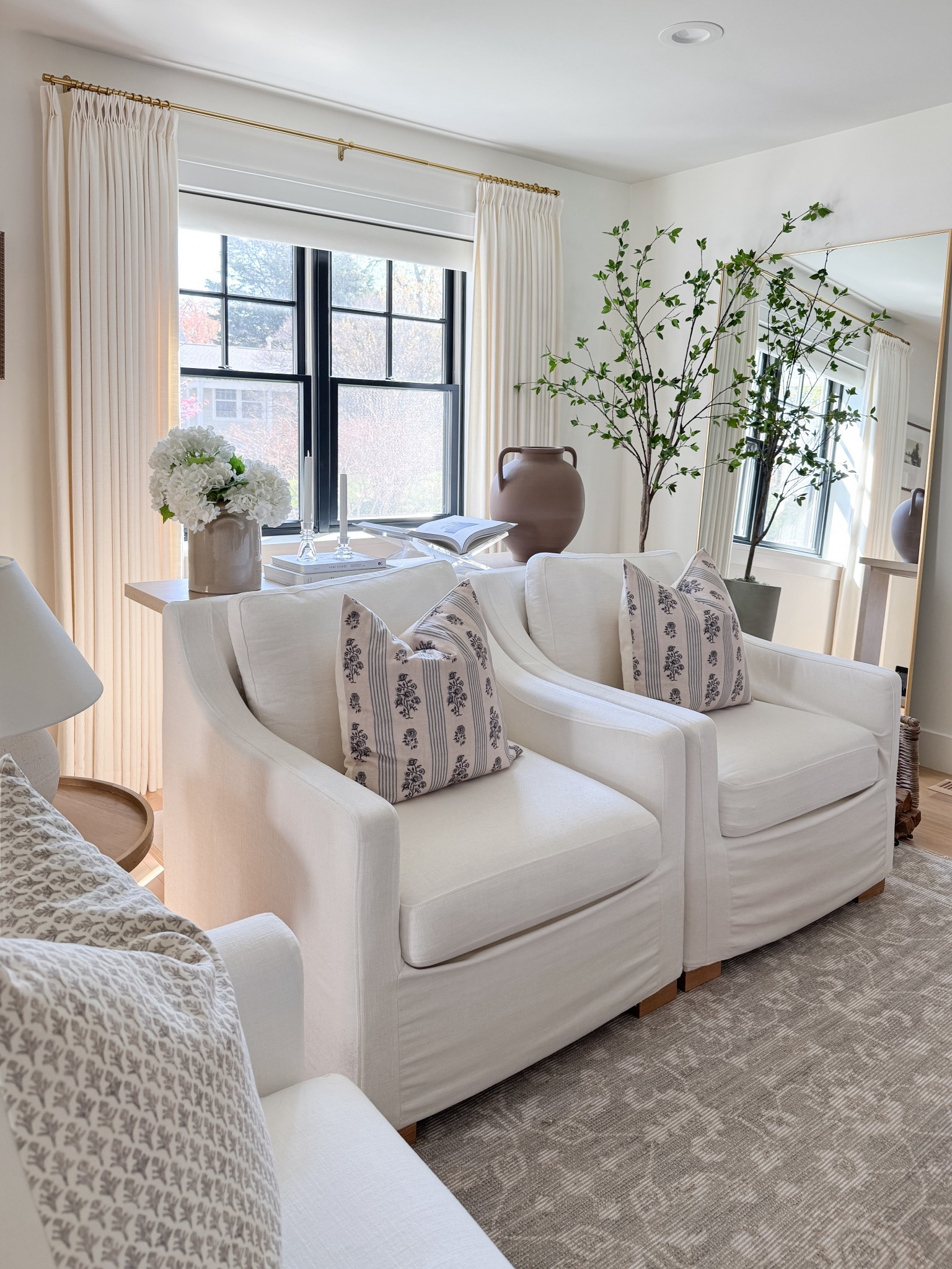 Soft whites ivory with some pops of green accents and a muted neutral rug make our living room room feel so calm yet collected. 

#LTKSaleAlert #LTKmomlife #LTKHome