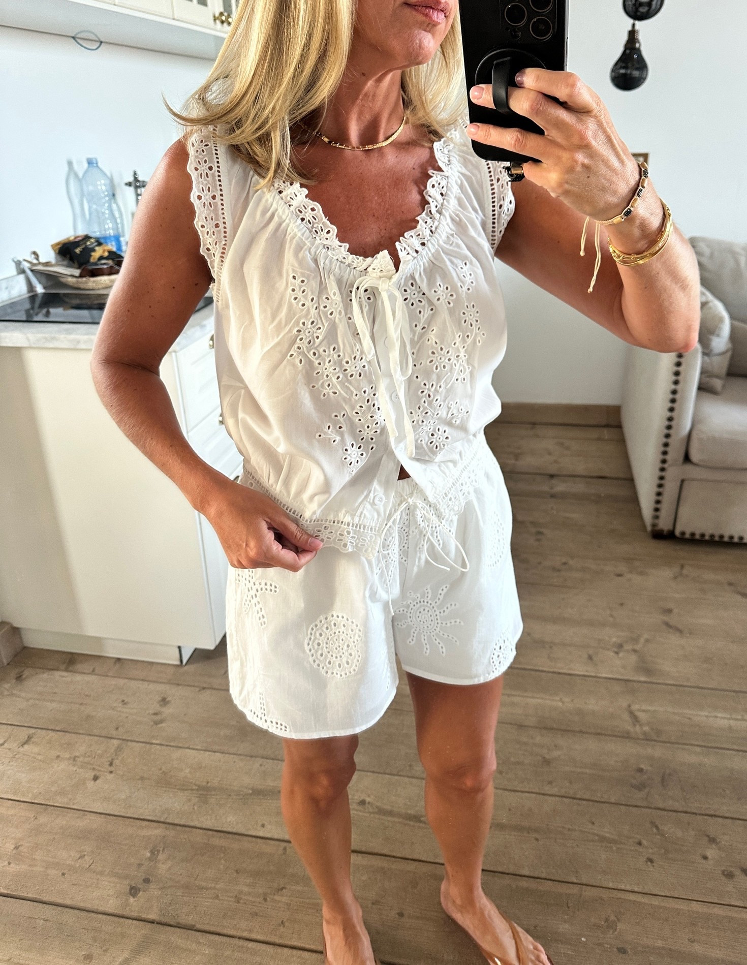 Love this white top for super hot days - lightweight but not see thru. (Looks like $$$ Doen one but only $12!) I wore these flip flops around town and the pool. Love the nude straps. go with your larger size…I’m normally an 8.5 but got the 9. (Whole sizes only) 
Linked similar shorts. 

Summer vacation Greece Spain Italy Mallorca white eyelet set

#LTKTravel #LTKOver40 #LTKSeasonal