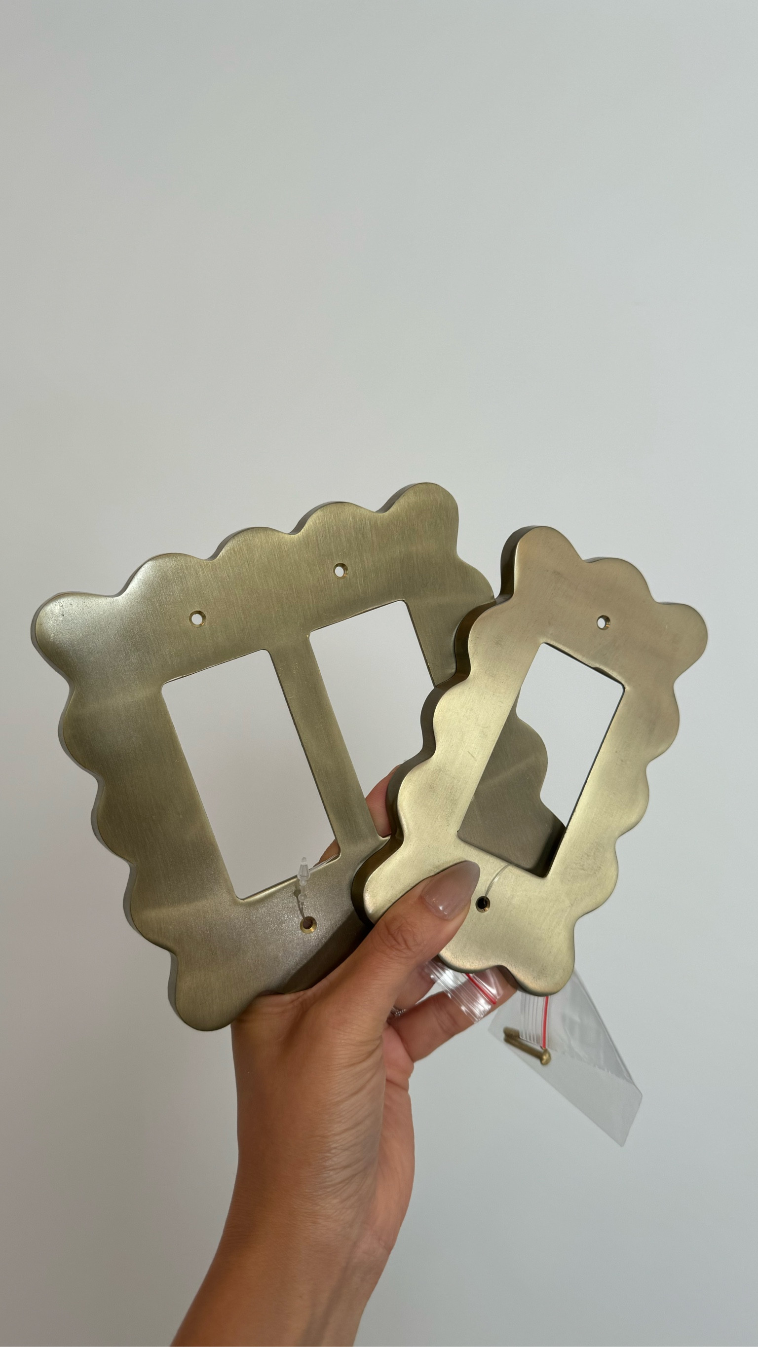 Anthropologie wiggle switch plate m. These are the bronze single and double rockers. They also have it for toggle switches and outlets too in five other colours including matte black, light sand, silver, pink and kelly green. This simple change shows a lot of character and elevate your space!

#LTKFindsUnder50