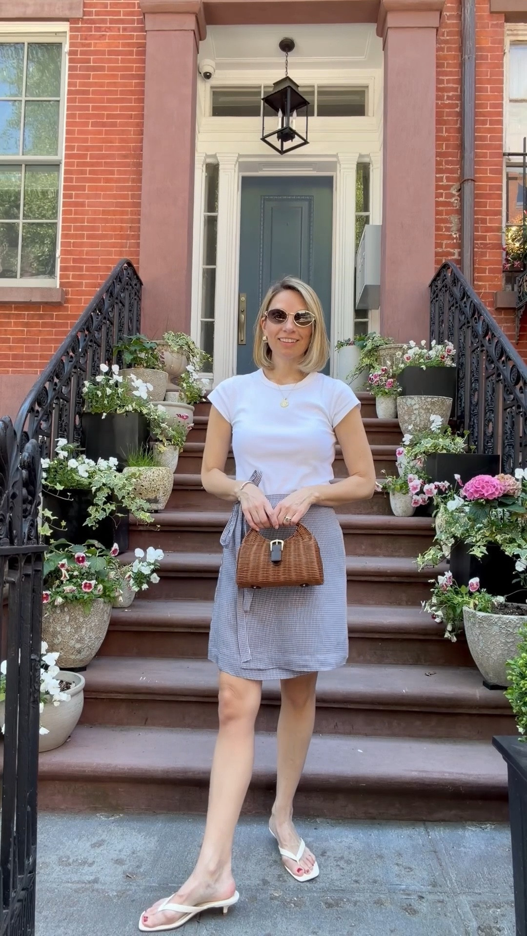 Casual summer outfit. This wrap skirt feels like a 90s throwback. The white t-shirt is my current favorite - fits nicely but still comfortable. These 90s inspired white kitten heel sandals are also comfortable - walked around in them and no blisters!

#LTKootd #LTKSaleAlert #LTKgrwm
