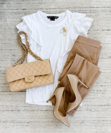 Spring workwear with white ruffled tee paired with skinny tan trousers and pumps for a chic look. Love this for workwear or date night. Can be dressed up with a blazer

#LTKworkwear #LTKstyletip #LTKSeasonal