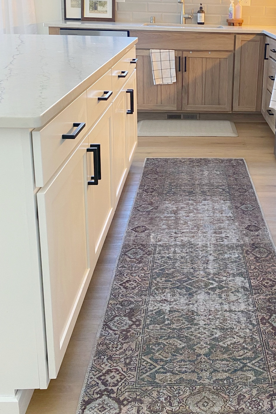 I usually hate rugs in the kitchen. But I love this one because it feels more like a mat and is super easy to clean. I think that it is important to incorporate your decor into your kitchen in open concept houses. It makes it look more cohesive and put together  

#LTKhome