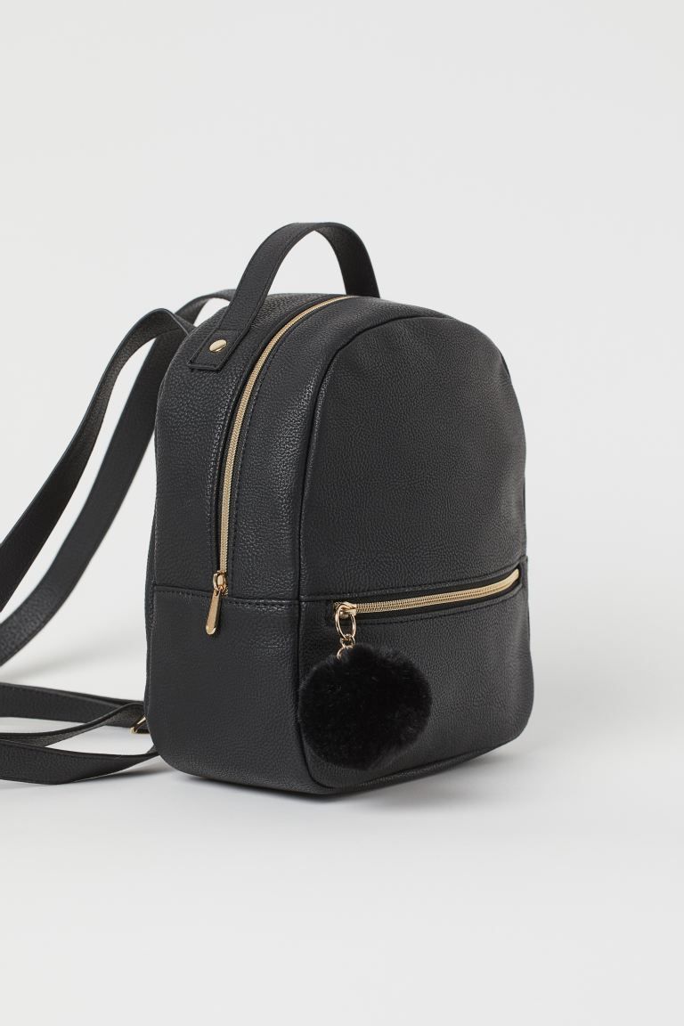 Small backpack with narrow, adjustable shoulder straps and a handle at top. Large compartment at ... | H&M (US + CA)