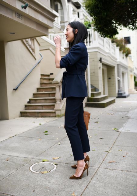 Professional office outfit: belted blazer, crewneck shirt, and navy trousers.

#suedepumps
#workoutfit
#businessprofessional
#modernworkwear
#summerworkwear

#LTKstyletip #LTKSeasonal #LTKworkwear