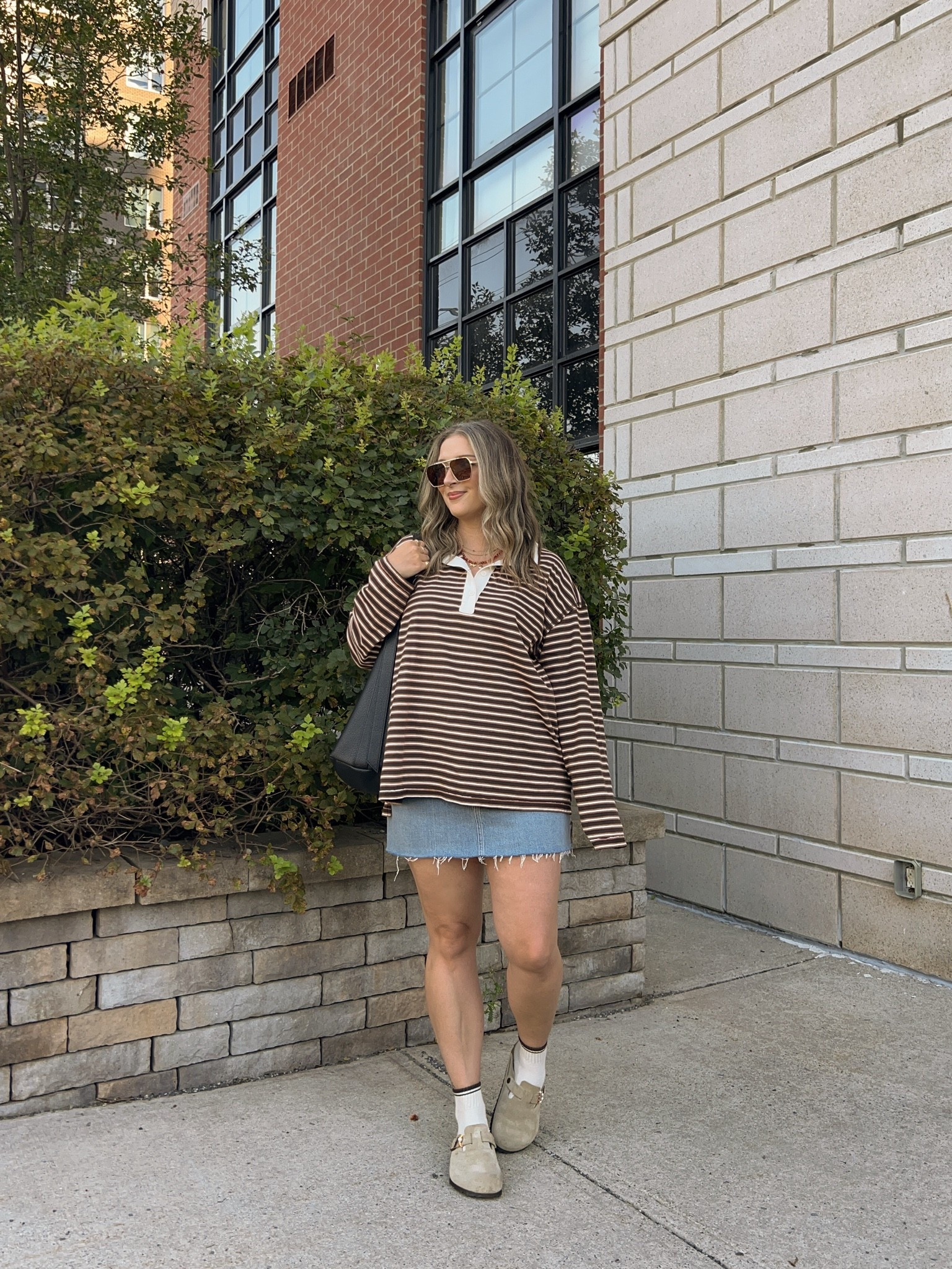 Early fall outfit! Wearing L in the striped rugby polo top, it’s very lightweight so still works for warmer weather! I bought this denim skirt last year in a size 32, would do a 31 if I was purchasing now. I’m a 9.5-10 shoe and wear a 40 in the Birkenstock clogs

#LTKfall #LTKmidsize #LTKstyletip