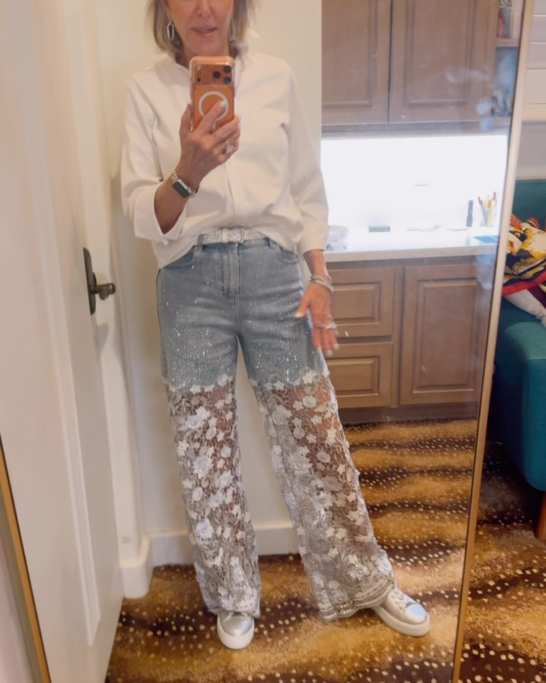 Stretch Denim High Rise Lace Embellished Wide Leg Ankle Jeans
Saint & Sofia silver sneakers 
Trending white button front shirt. 
Dean Davidson luxury fashion earrings and rings. 
Rhinestone belt 
Silver bag not shown 

#LTKgrwm #LTKOver40 #LTKootd