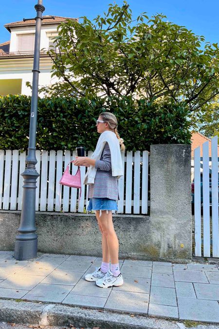 Plaid Blazer. Fashion Blogger Girl by Style Blog Heartfelt Hunt. Girl with blond hair wearing a plaid blazer, pink T-shirt, white cat-eye sunglasses, denim skirt, pink Staud bag, pink socks and New Balance sneakers. #plaidblazer #denimskirt #pinklook #scrunchiestyle #colorfuloutfit #colorfulstyle #colorfulfashion #colorfullooks #fashionfun #cutefalloutfit #fallfashion2023 #falllookbook #fitcheck #dailylooks #dailylookbook #contentcreator #microinfluencer #discoverunder20k