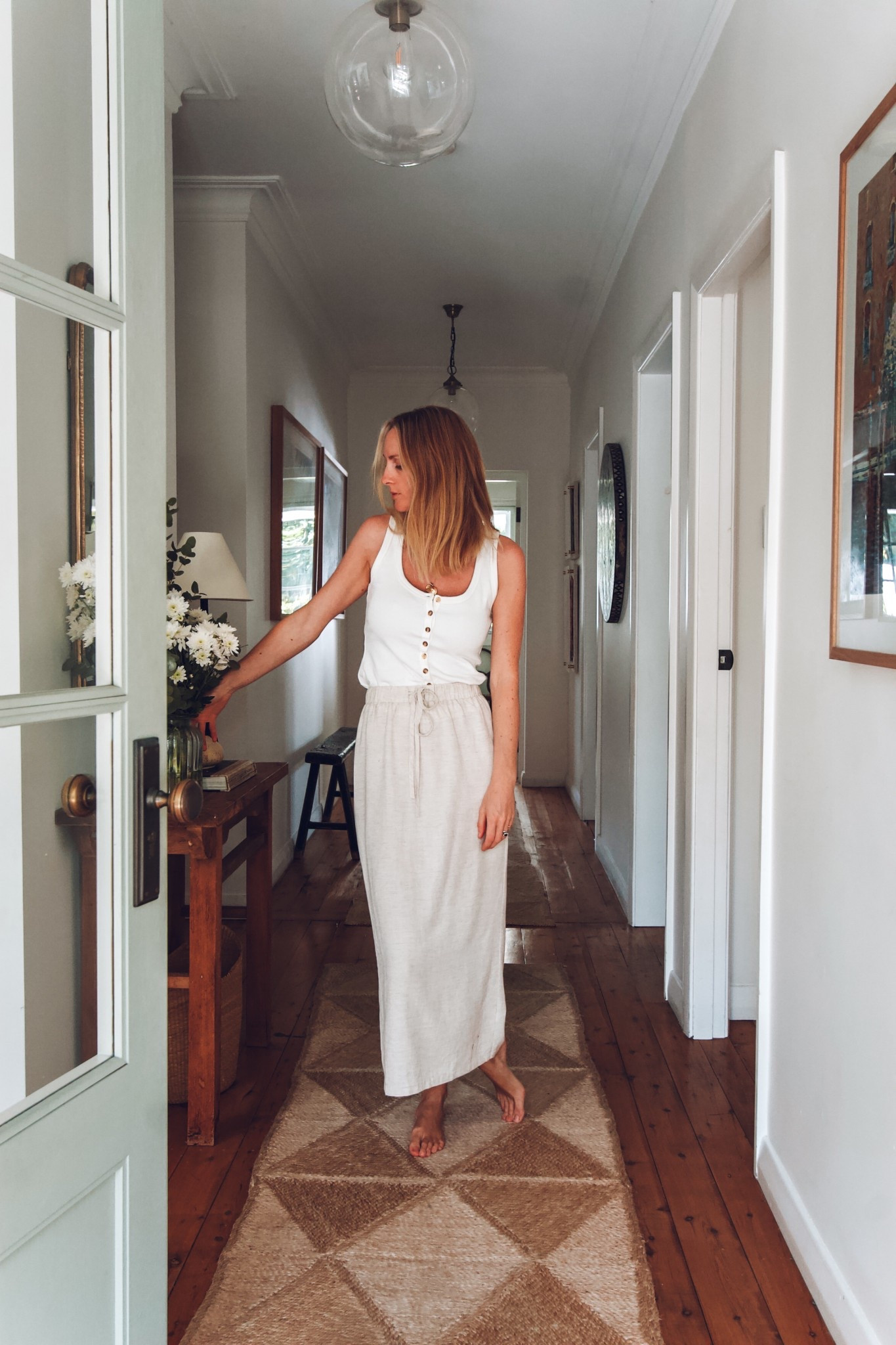 Lightweight singlet with delicate button accents, styled with a classic linen skirt this weekend. 

#LTKaustralia #LTKautumn