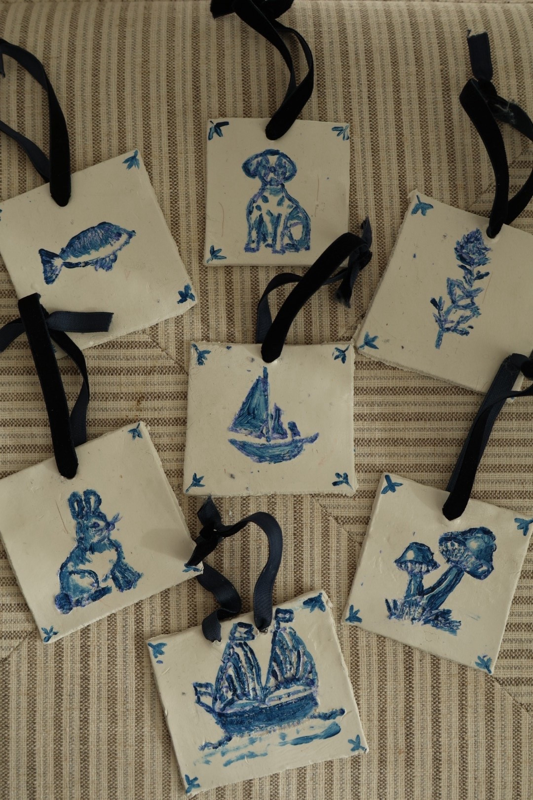 DIY delft tile christmas ornament!! here’s everything you need for this look! 

This was my favorite Christmas craft EVER!!!
I'm not the best artist and they aren't perfect but I love anything delft and it's a fun addition to my tree- I promise it's not as hard as it looks either— here's the step by step:
You'll need: air dry clay, thin blue velvet ribbon, light blue @sharpie, blue paint, small paint brush, rolling pin, something to cut the clay with,@modpodgecrafts
1. Roll out air dry clay and cut it into a square
2. Make a little hole in the center where the ribbon will go
3. Google "vintage delft tile" and copy whatever pattern you want onto the air dry clay by first outlining the drawing with a light blue sharpie
4. Re-trace your drawing with a thin paint brush and blue paint
5. Once paint is dry, apply one coat of Mod Podge
6. When the mod podge is dry and the clay has hardened, string your choice of thin velvet ribbon through the hole and you're ready to hang (or gift) your ornament!
I love that these can now be heirloom

#LTKHome #LTKmomlife #LTKHoliday