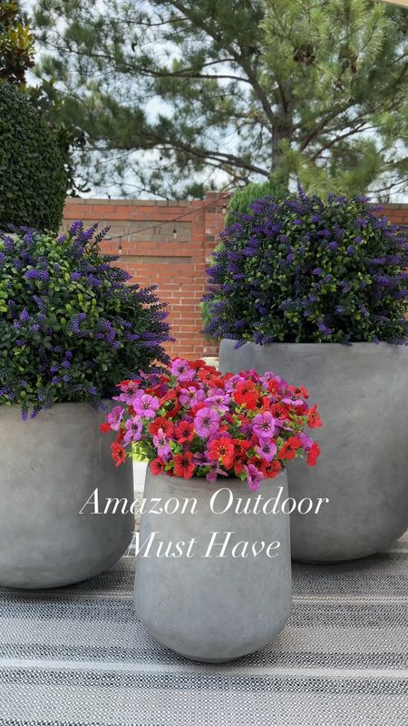Wow!! I am absolutely in love with these faux topiaries and faux flowers!! I love the pop of color and they look so beautiful!! They have given my backyard a pop of color and no need to worry about watering and the strong Texas sun. Absolutely gorgeous cement planters that come in a set of 3 and very well priced for the set of three. 

#LTKStyleTip #LTKHome #LTKVideo