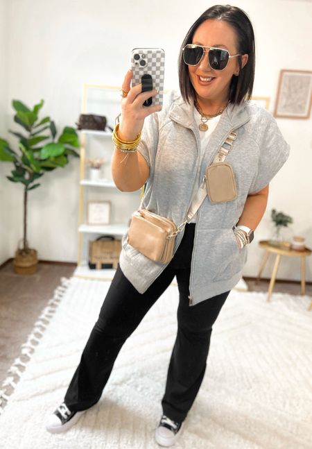 Casual weekend outfit!  Mostly all Amazon finds!  XL sweatshirt vest. Prefer a large. XL ribbed tee. XL flare leggings from Walmart!  Loving this more casual crossbody bag. Converse fit tts  

#LTKmidsize #LTKstyletip #LTKfindsunder50