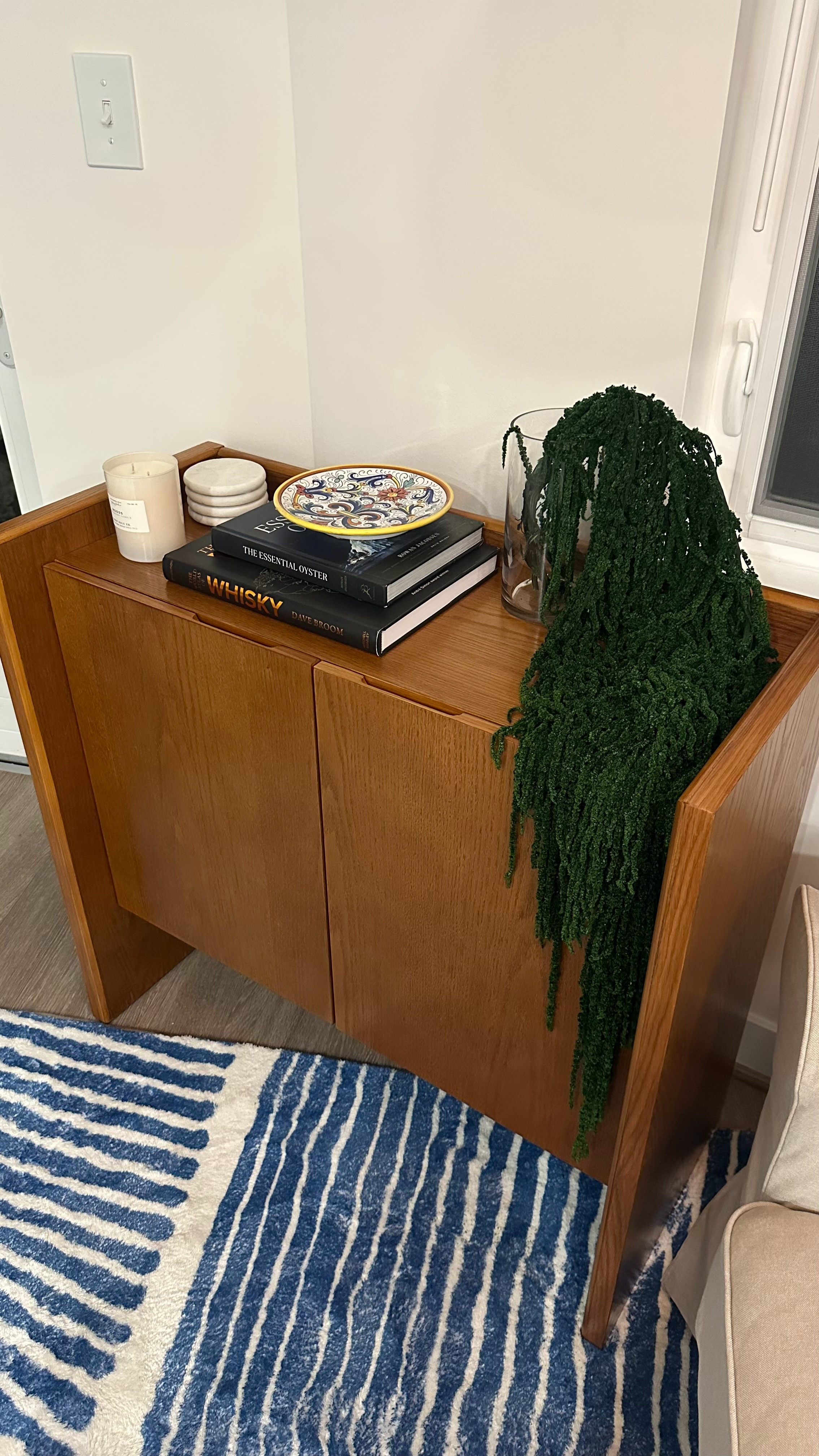 New bar cabinet in the living room with fun decor.  

 #LTKHome #LTKFindsUnder50 #LTKStyleTip