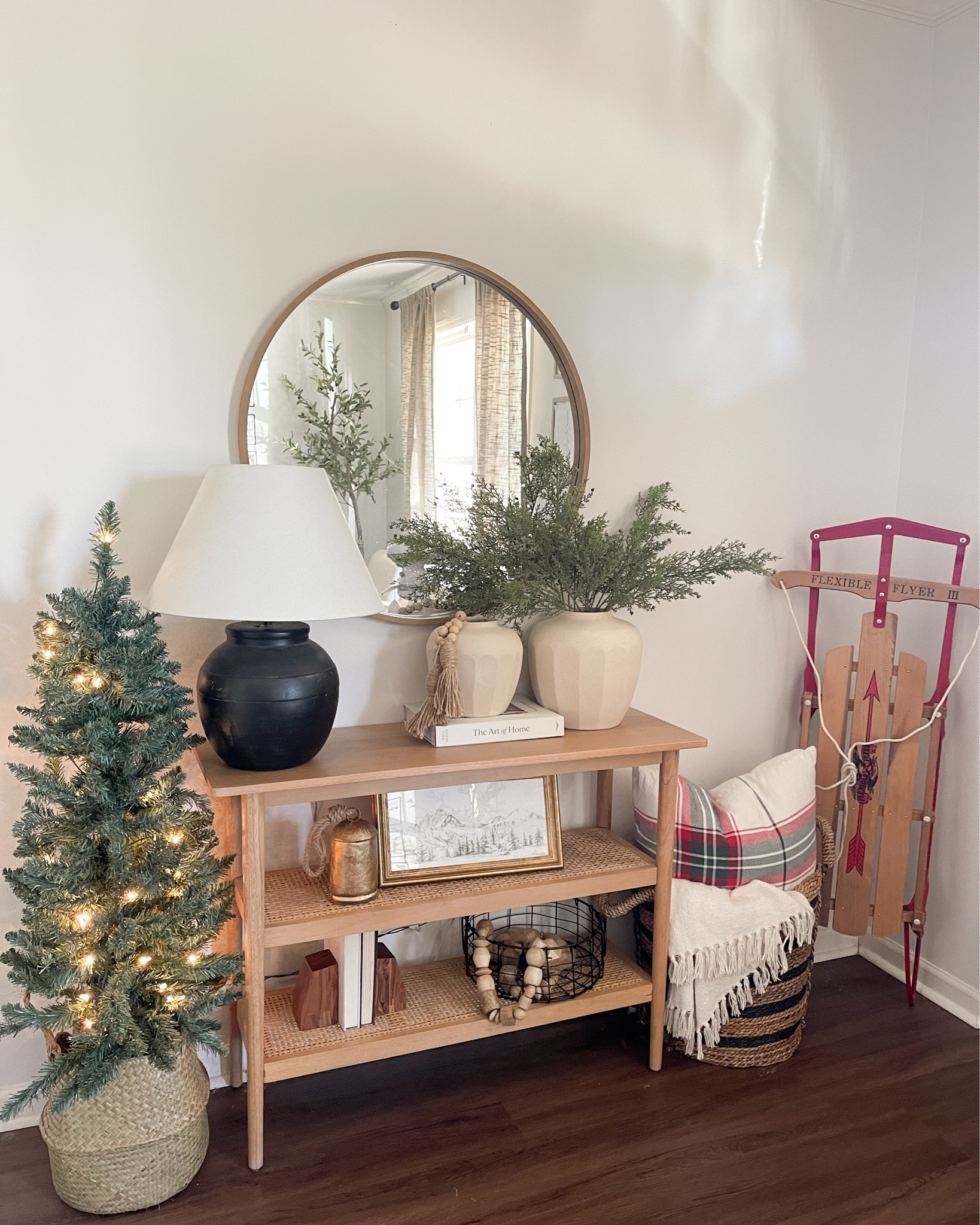 Christmas entryway styling. Christmas tree. Gold bells. Winter art. Radio flyer sled. Holiday decor. Neutral Christmas decor. Round mirror. Studio mcgee style.

#LTKstyletip #LTKhome #LTKHoliday