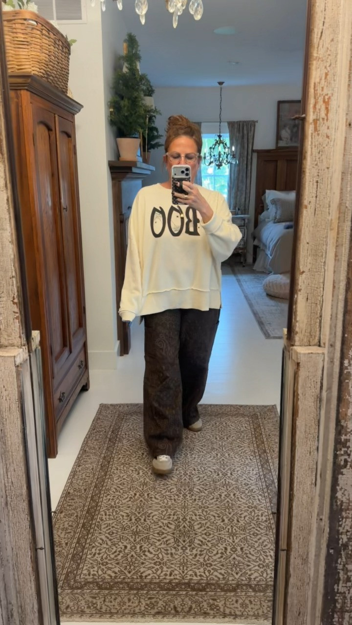 I love this boo graphic sweatshirt from Walmart. I paired it with a pair of wide leg pants that I have in multiple patterns.  

 #LTKSeasonal #LTKMidsize
