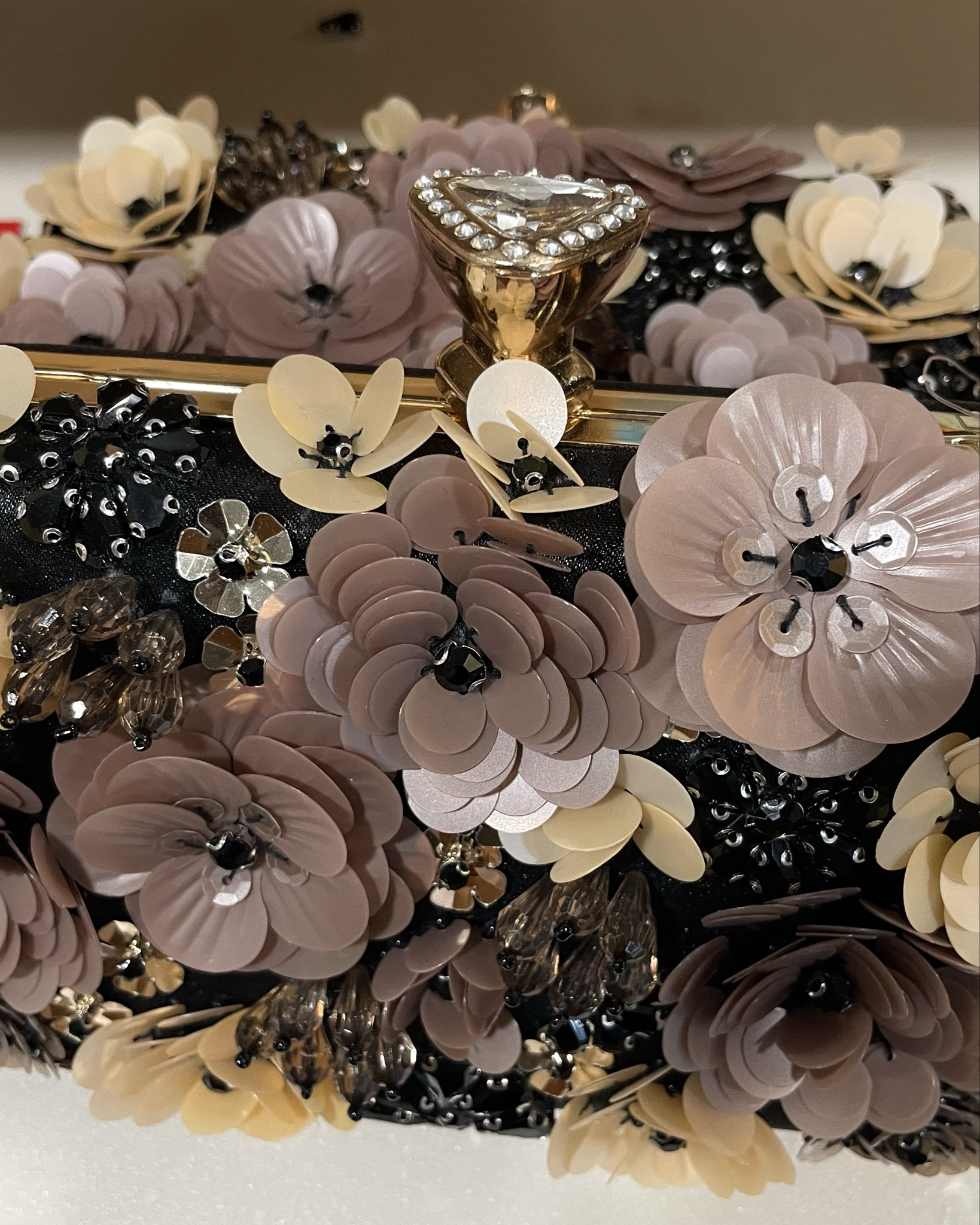 The Floral clutch from Kelly & Katie with sequin and beaded flower gold-toned top handle and chain crossbody strap

#LTKSaleAlert