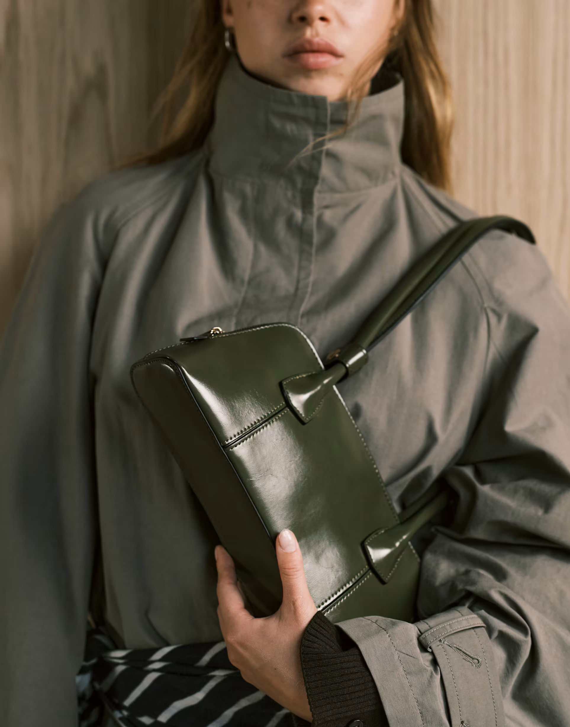 ASOS DESIGN elongated handle curved base bowler bag with seam details in olive | ASOS (Global)