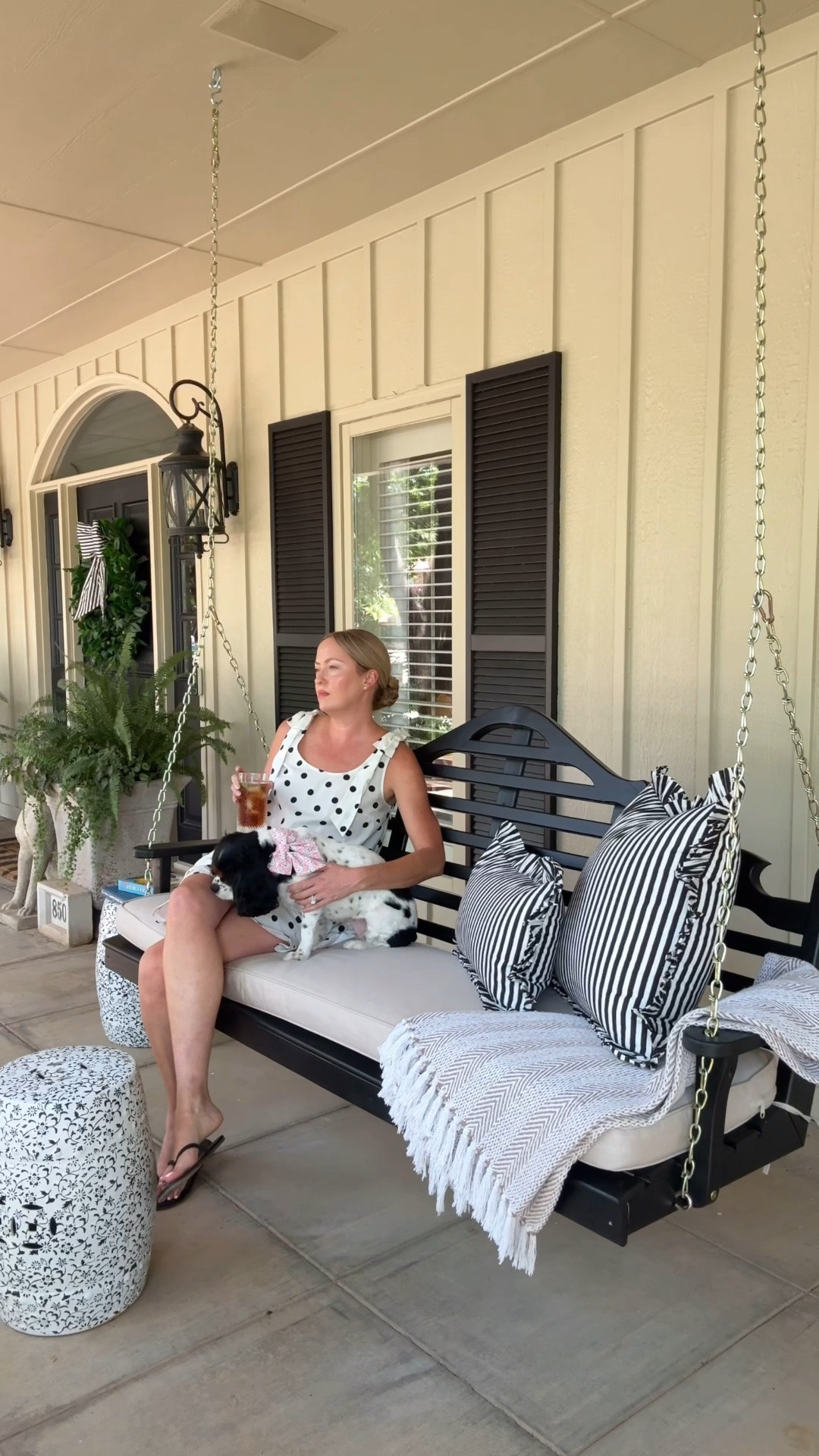 You know where to find us! I can’t think of a sweeter way to spend a summer afternoon than swinging with my favorite little sidekick, cold drink in hand.

Ever since we moved in I’ve dreamed of two oversized porch swings out here! Our two new swings from @porchswingcompany have officially made my dreams come true, and now this my favorite spot at home. I love how classic and welcoming they feel—and having two means there’s always room to sit and stay awhile. 🤍

I’m so pleased with the quality of the products from The Porch Swing Company! The swings are sturdy, beautifully painted, and easy to install. Also love the Sunbrella cushions. They’re the perfect fit and make the swings so comfy. 

If you’re looking for the black and white striped wreath sash and ruffle pillows please visit graceharriscollection.com

#graceharriscollection #frontporchdecor #porchswing #theporchswingcompany

#LTKHome
