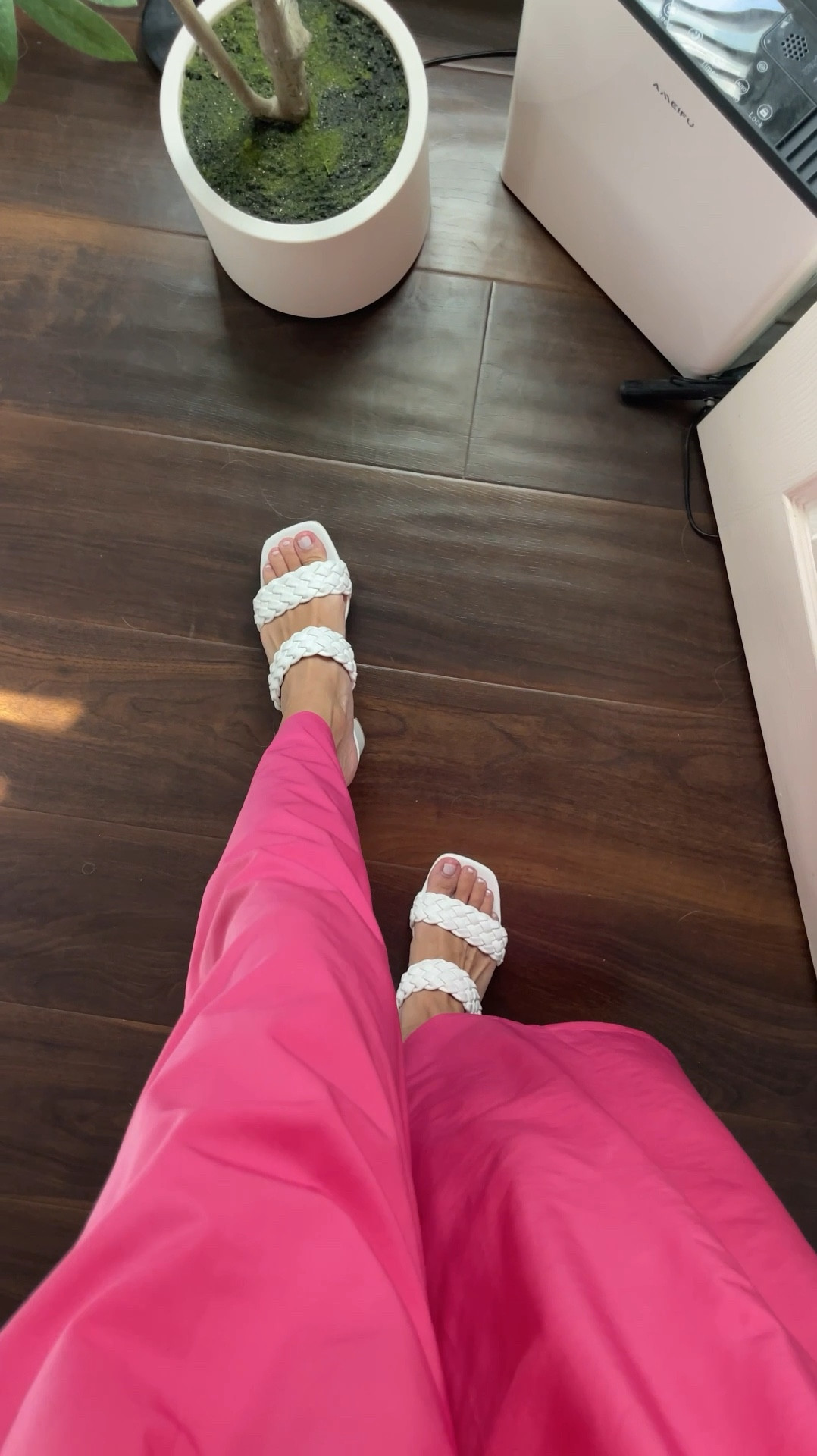 Pink pants posse? Sign me up! At first I wasn’t sure about these high waisted barbie pink slacks, but I found that the flowy pants material is really lightweight which i love for summer. Pair with your favorite double lined tank top or body suit  

The white braided strap sandals are a staple under denim jeans as well as these pink pants. The heel is moderate and the woven slides style is always a classic that never goes out of style. 

#LTKShoeCrush #LTKVideo #LTKStyleTip