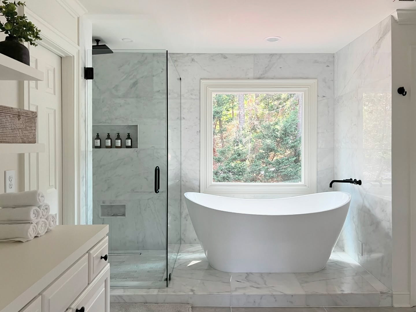 Primary bathroom transformation! Adding a free standing tub totally elevates a bathroom. We also redid all the shower and floor tiles. Another drastic difference without changing the footprint, which can be costly and time consuming! 

 #primarybathroom #primarybathroomdesign #freestandingbath #rainshower #flooranddecor #bathroomdesign #bathroomremodel #interiordesign #bathroominspiration #bathroomideas #marblebathroom #styleinspiration #spabathroom #spabathroomdesign