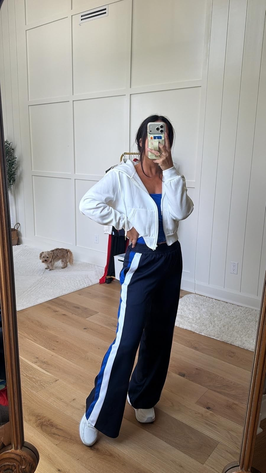 The perfect sporty-chic outfit! This cropped white hoodie and striped wide-leg track pants are so comfortable for errands or travel days.
#AthleisureStyle #SportyChic #TravelOutfit #CasualOutfit #LTKFinds