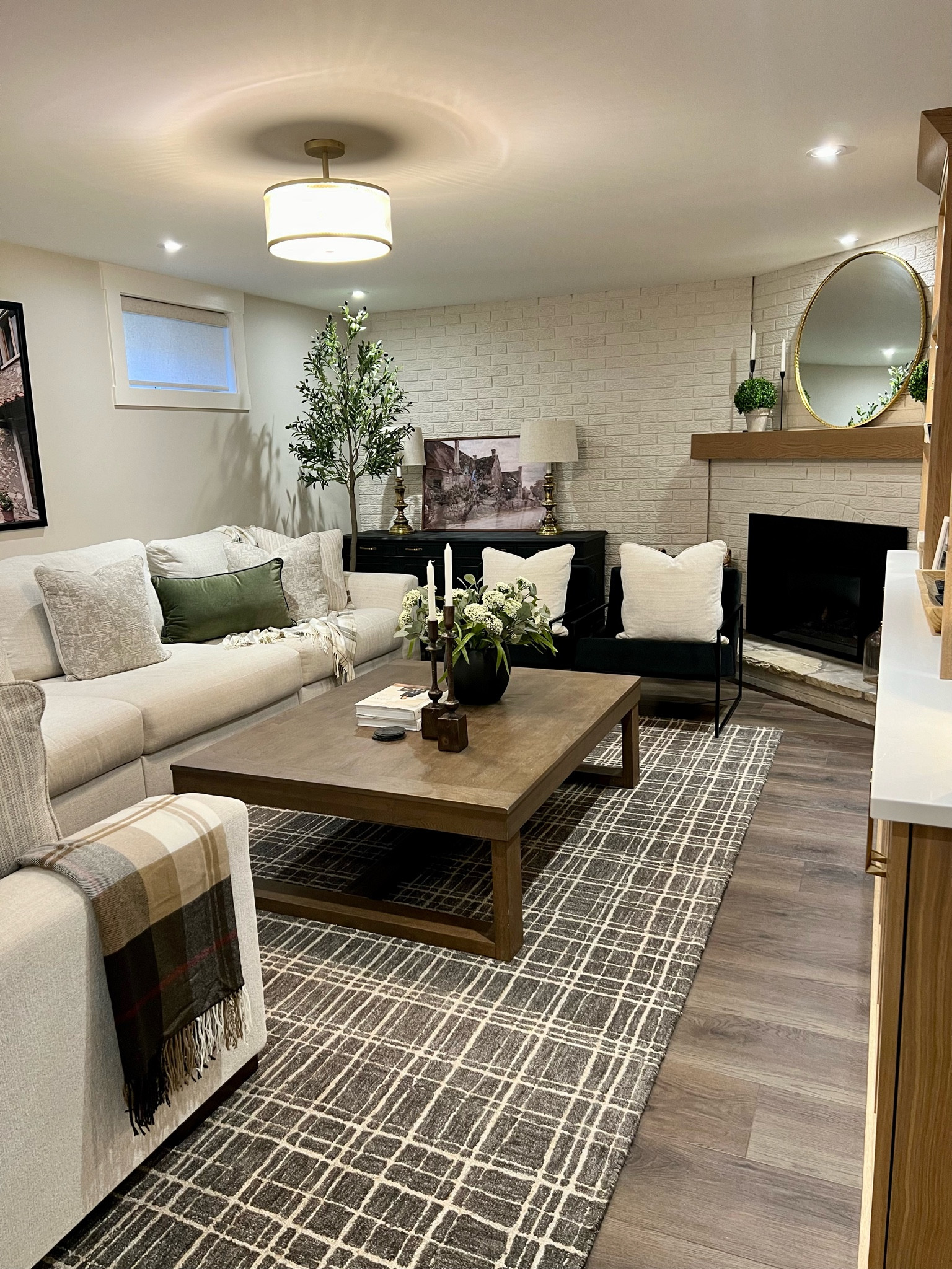 Neutral basement! 

Area rug
Coffee table
Stems
Faux greenery
Sectional 
Ashley furniture
Round mirror
Gold mirror
Credenza
Olive tree
Faux tree
Candlesticks
Pillows
Throw pillow
Throw blanket
Pendant
Gold Light
Semi flush mount light 
Grey rug
Neutral rug


#LTKstyletip #LTKsale #LTKcasa