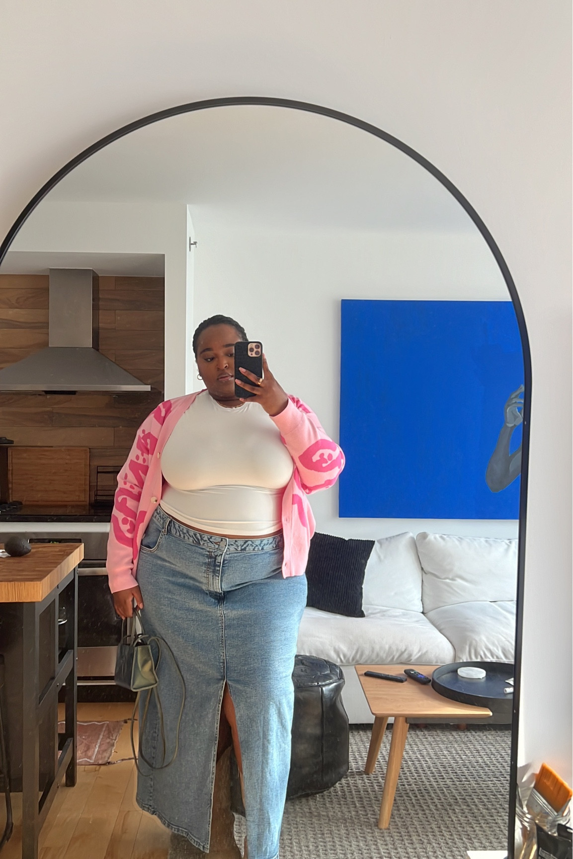 The exact sweater is from Rebdolls: “Lady Knit Abstract Print Oversized Button Up Cardigan”. And the exact boot is from Torrid: “Midshaft Western Boot” (it might be sold out so I couldn’t add the link)