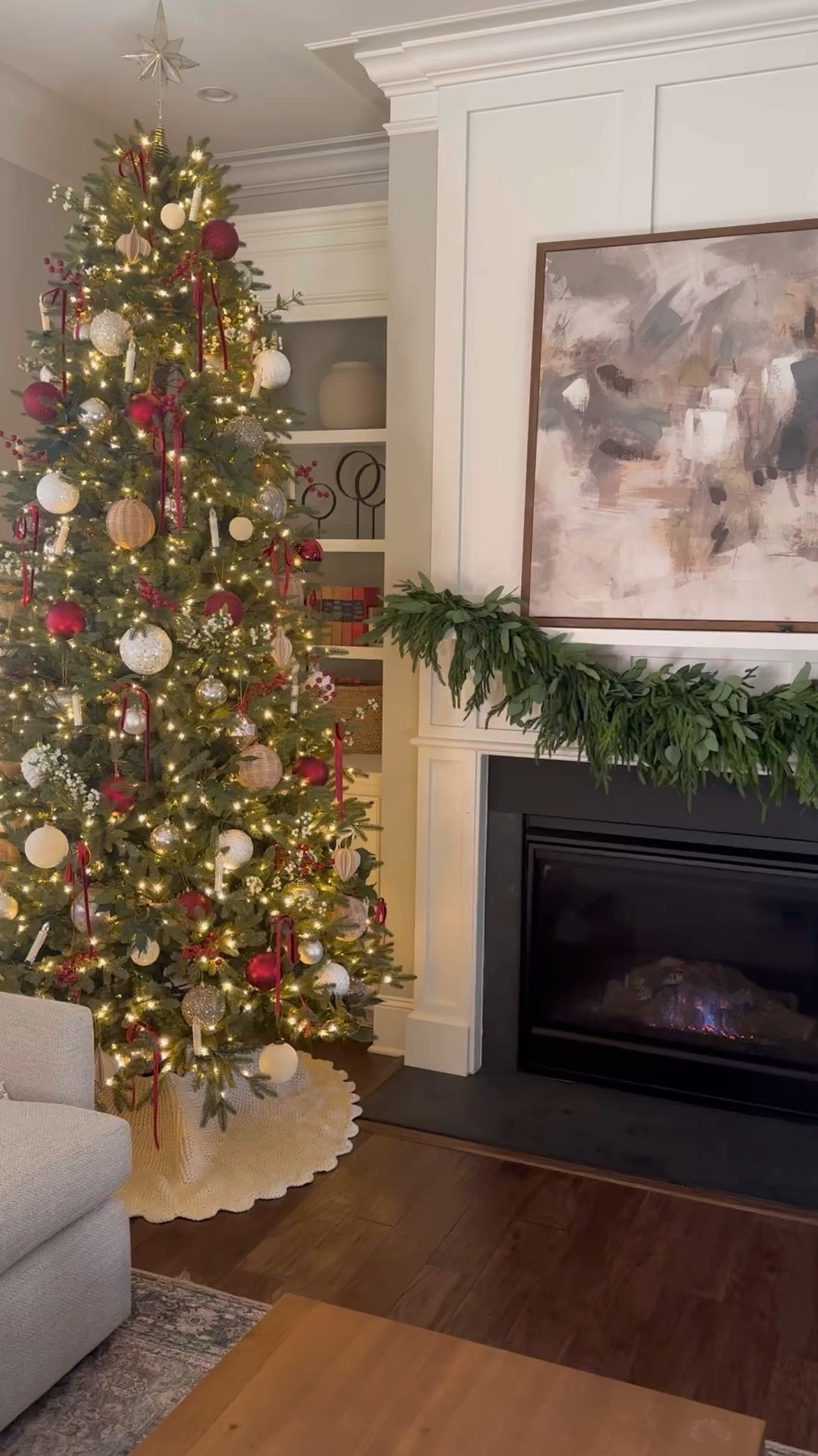 This year’s Christmas tree reveal! I got a new 9’ tree and this one is so realistic but also pretty inexpensive compared to similar trees for sale. I went with a red/burgundy theme this year with my ornaments and I love how classic looking it turned out! 

Christmas decorations, mantel decor, garland, Christmas bookcase, Christmas bookshelves 

#LTKHome #LTKWatchNow #LTKHoliday