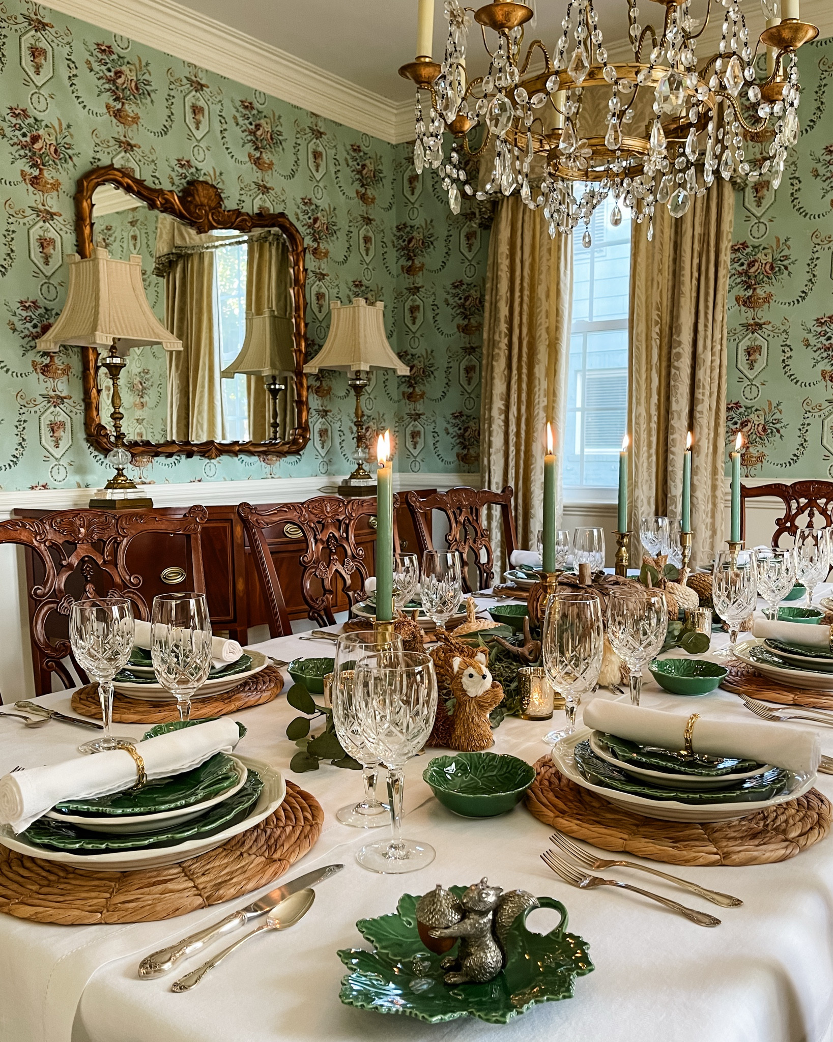 Who else loves setting a table that feels just as special as the memories made around it? Today, I’m sharing a favorite fall tablescape that brings together natural elegance and cozy, earthy vibes. It might not be your typical fall color palette, but the warm browns and soft greens work beautifully in our dining room. 🍂✨

The crisp white linen tablecloth sets the stage for eucalyptus swags, a bark-covered pumpkin centerpiece, and fun, whimsical touches like faux deer antlers, straw critters, and Hyacinth pumpkins. And don’t get me started on the brass candlesticks with green tapers—talk about an autumn glow! Each place setting has its own charm with Hyacinth chargers, leaf-patterned dinnerware, crystal glasses, and silver flatware to tie it all together. 🍂✨

I hope this inspires your next gathering, whether it’s a cozy family dinner or a festive get-together with friends. Do you have any favorite fall table traditions or special memories you’ve made around the table with friends or family? Share your story below, I’d love to hear! 🍂✨

#FallTableInspo #CozyTableVibes #AutumnTablescape #SeasonalEntertaining #ElegantFallDecor #TableSettingInspiration #FallDecorIdeas #GatherRoundTheTable #DiningRoomStyle

#LTKStyleTip #LTKHome #LTKSeasonal
