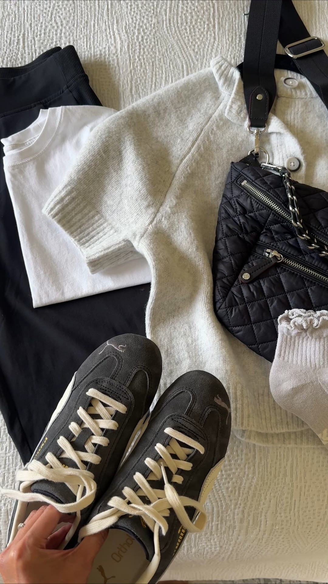 Everyday athleisure summer to fall outfit. 
- One of my all-time favorite athleisure pant styles that work out especially well for travel outfits because they are lightweight, look tailored, and don’t really wrinkle. True to size. 
- Cotton tank top with the perfect cut. True to size. 
- Short sleeve sweater cardigan ($25) that I shared with jeans recently worn here as a layering piece. 
- I am very into ruffle socks right now. So cute with mules and sneakers. These socks are soft and cushiony. 
- Sling bag. 
- Suede sneakers in a great worn dark gray color. True to size. 
- Silver bangle bracelets. 


#LTKShoeCrush #LTKFindsUnder100 #LTKActive