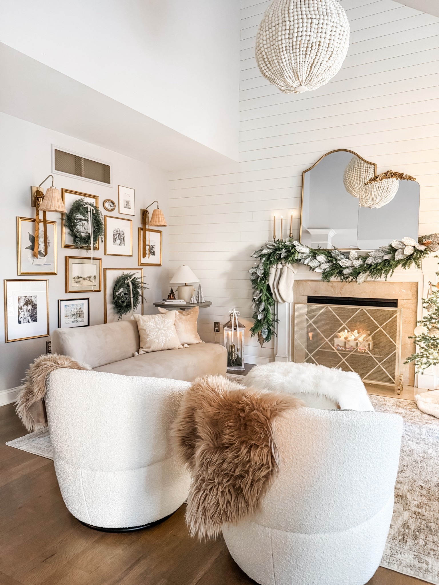 Christmas living room
Swivel chairs 
Bouclè swivel chairs
Round ottoman
Faux fur throw
Wicker sconce
Rattan sconce
Curved loveseat
Velvet sofa
Velvet loveseat
West Elm Mella loveseat
Wood bead chandelier 
Norfolk pine garland
Mantel decor
Living room area rug
Loloi neutral area rug 
Fireplace screen
Christmas decor
Gold phot frame
Gallery frame 


#LTKHoliday #LTKHome #LTKSeasonal