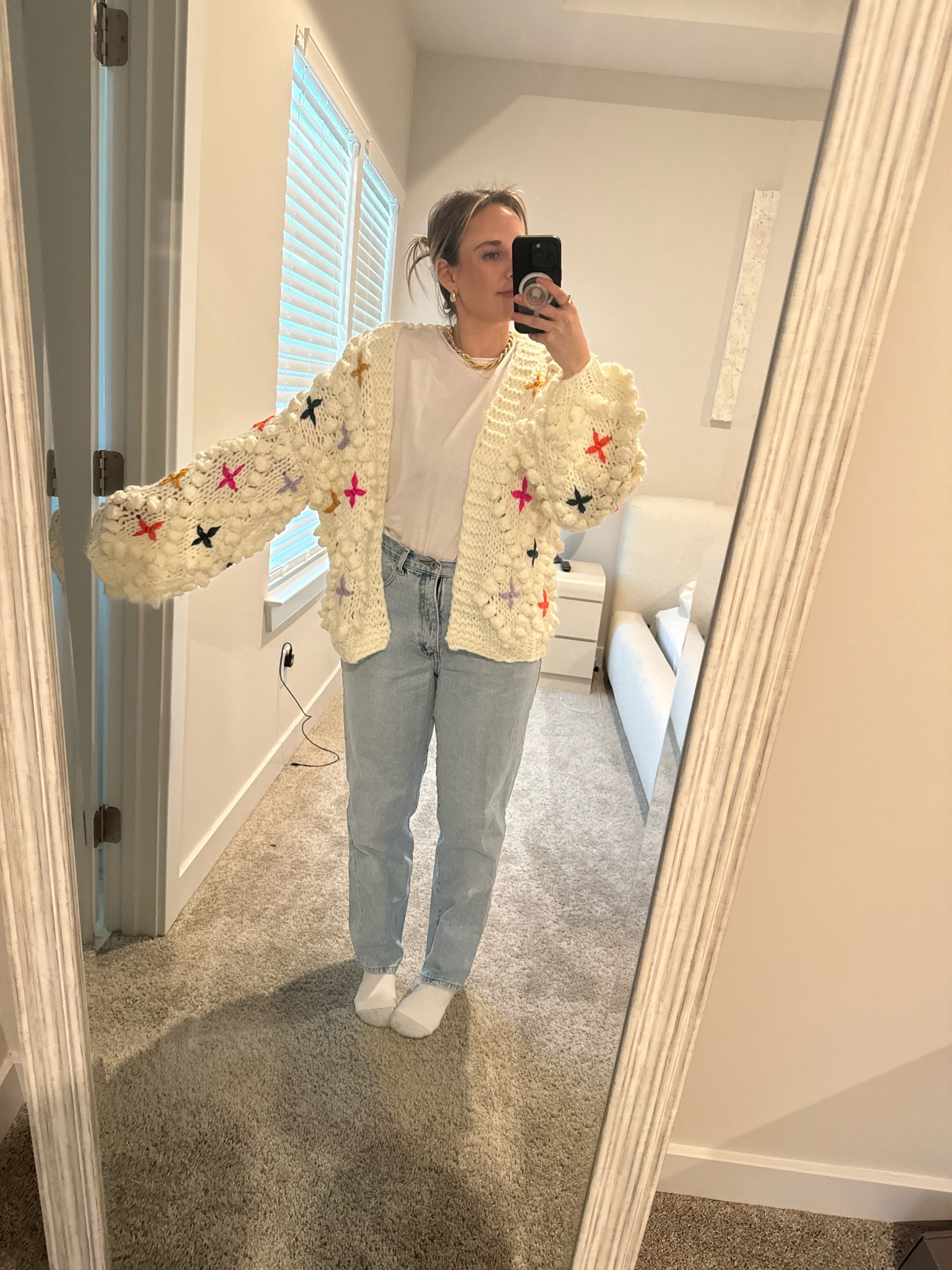 Cream chunky knit sweater with colorful accents 