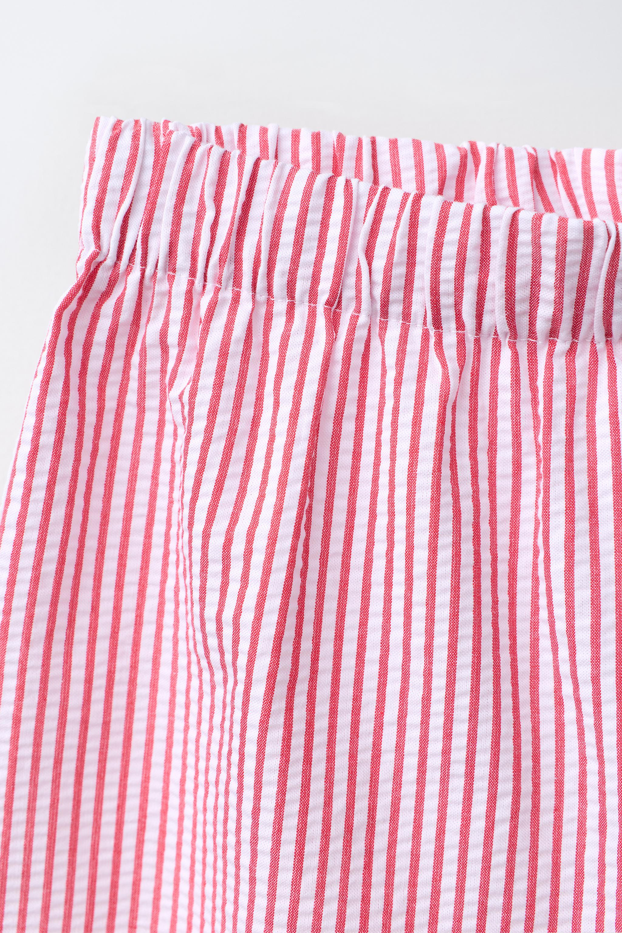 Wide-leg trousers with an elasticated waistband. Embroidered heart detailing at the hem with a sc... | Zara UK