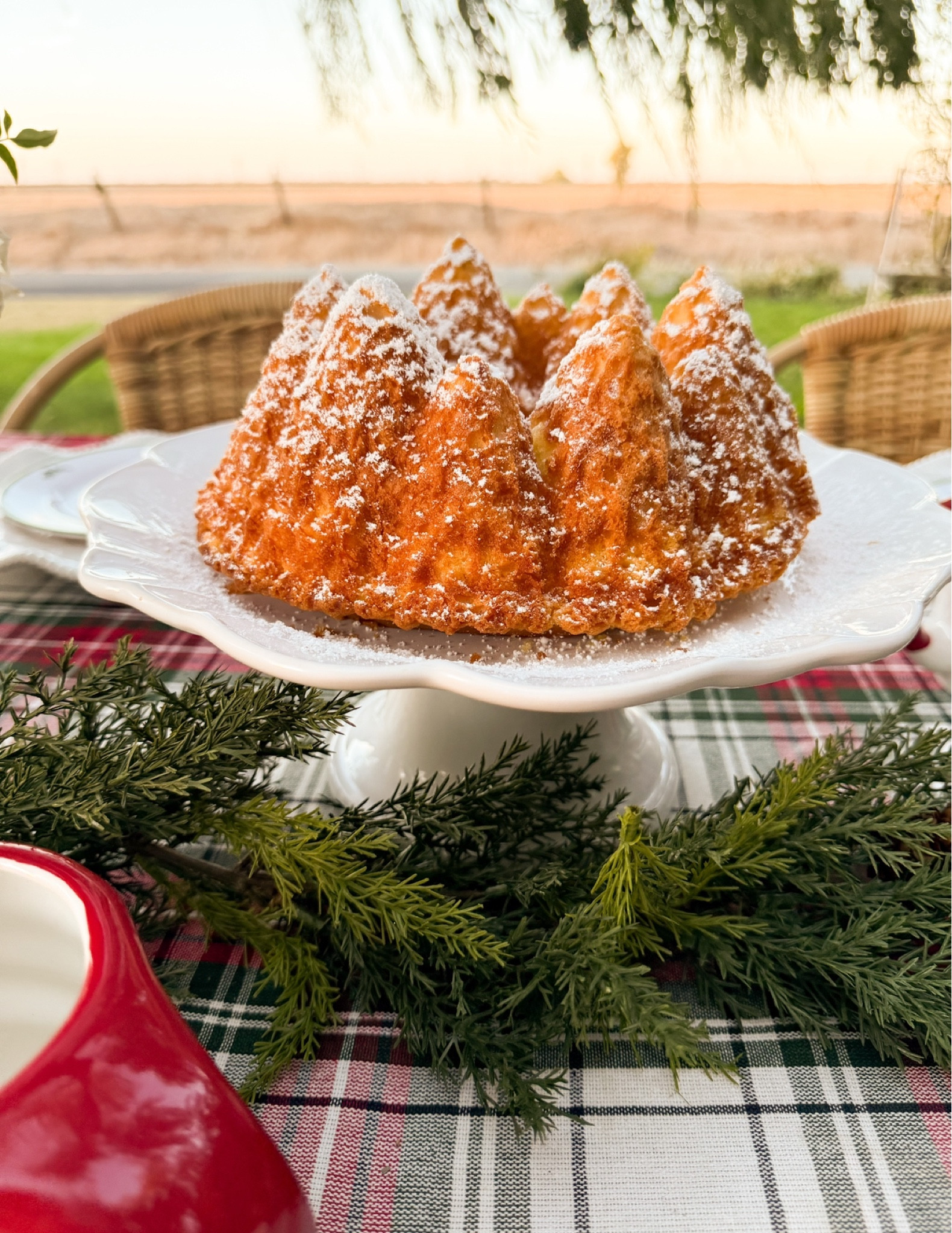 My Nordic Ware Pine Forest Bundt Cake Pan is a staple in my home! I use it year after year. This beautiful pan is so easy to use and it really makes a statement! It is perfect for a Christmas luncheon, a holiday party, and is a must for winter too! It looks great on this white cake stand, and really elevates this beautiful plaid tablecloth! This gorgeous cake pan and everything on my holiday table is available at @wayfair and it ships for free! #wayfair #wayfairpartner #ad #onlyatwayfair #paidlink

#LTKParties #LTKHome #LTKHoliday